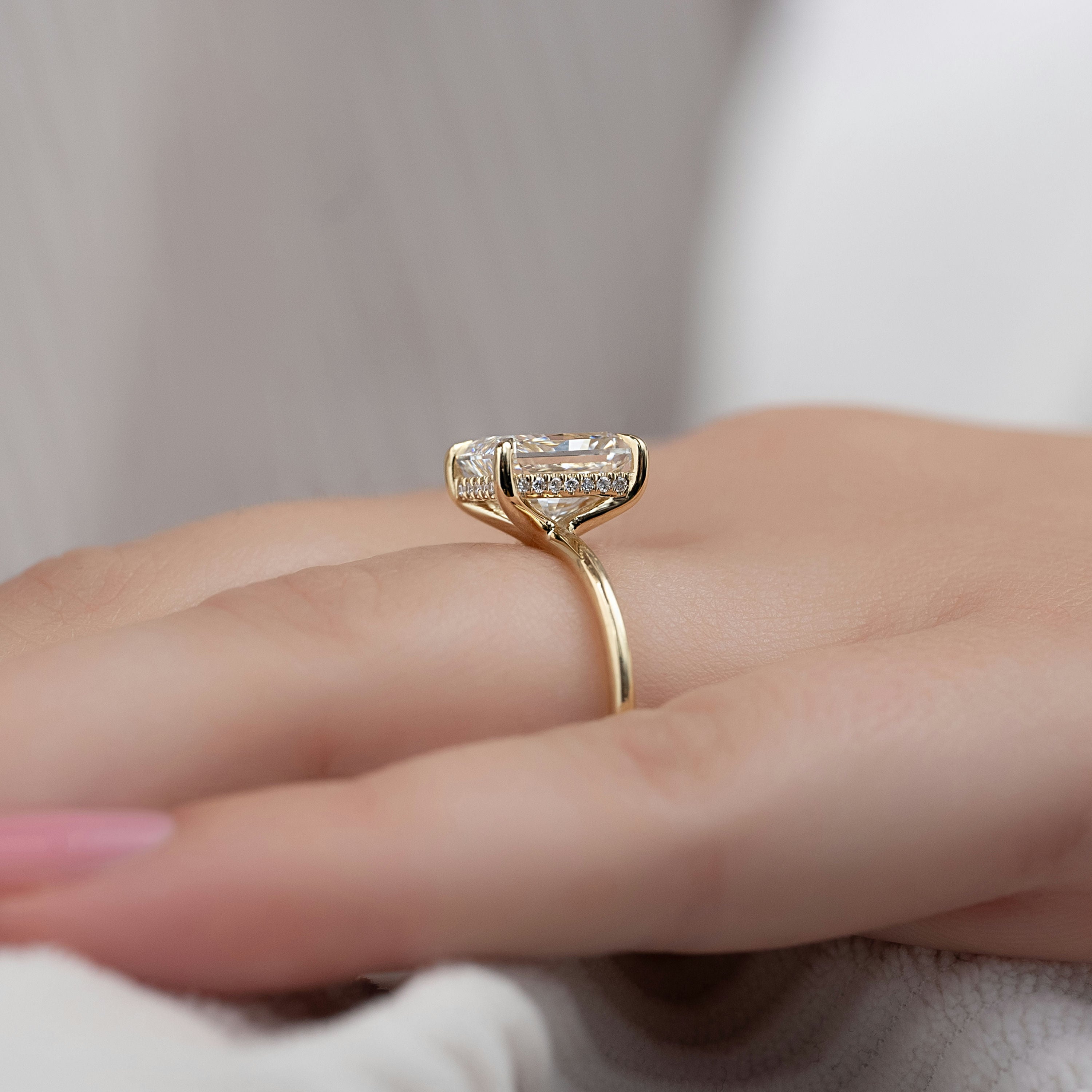 Radiant cut moissanite hidden halo engagement ring in white gold setting