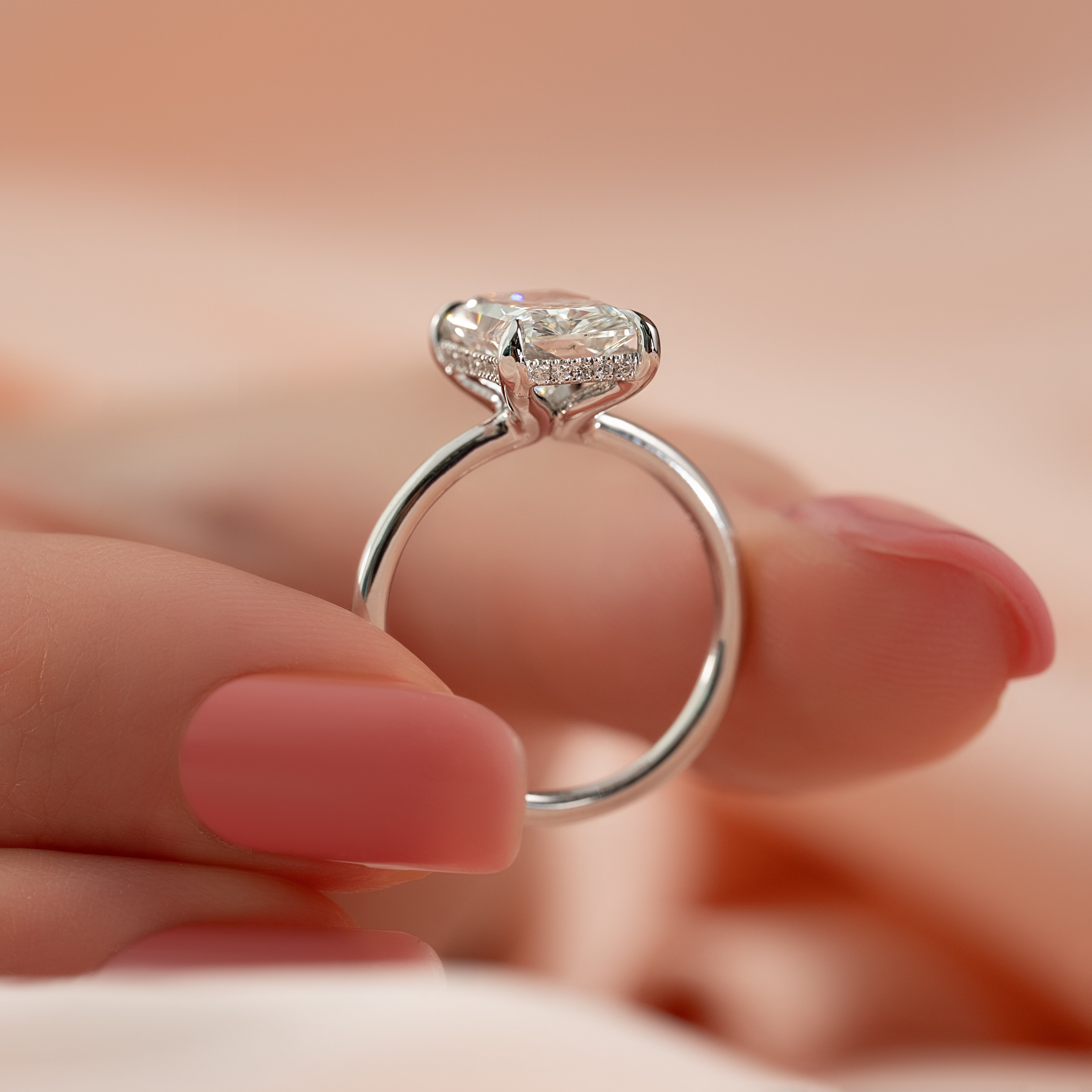 Radiant cut moissanite hidden halo engagement ring in white gold setting