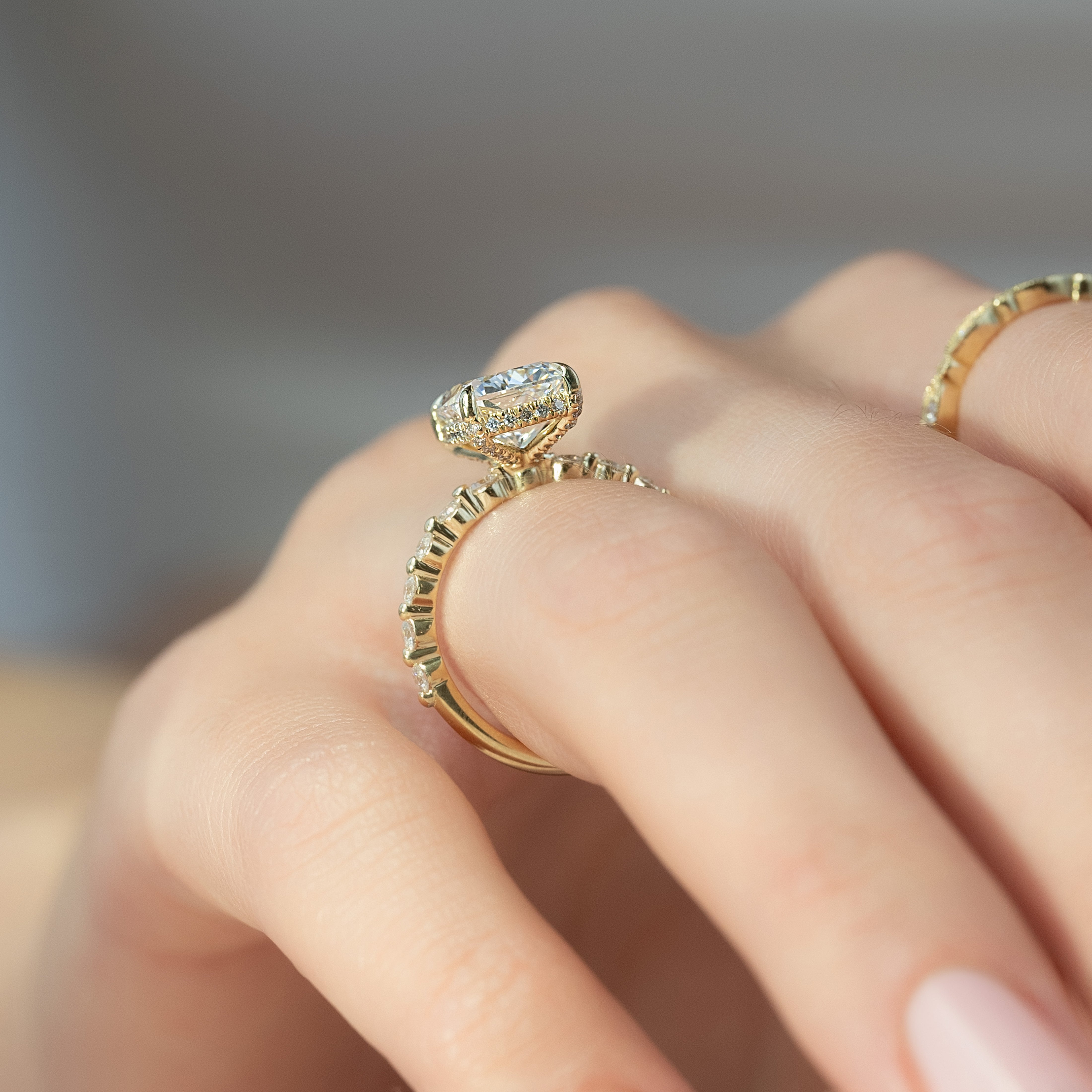 Elongated cushion cut CVD diamond ring with hidden halo and pave style band in platinum