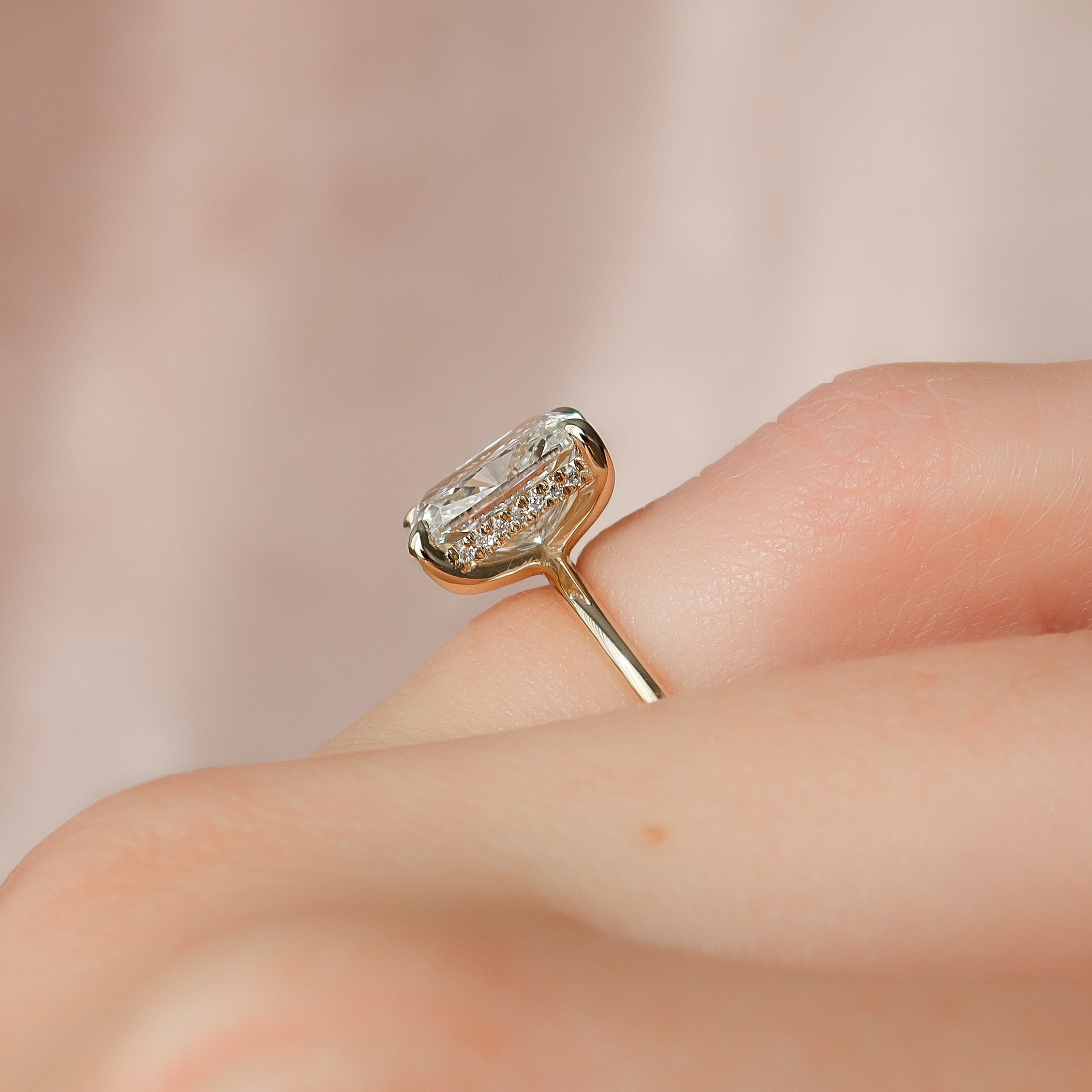 Elongated cushion cut CVD diamond engagement ring with hidden halo setting in white gold