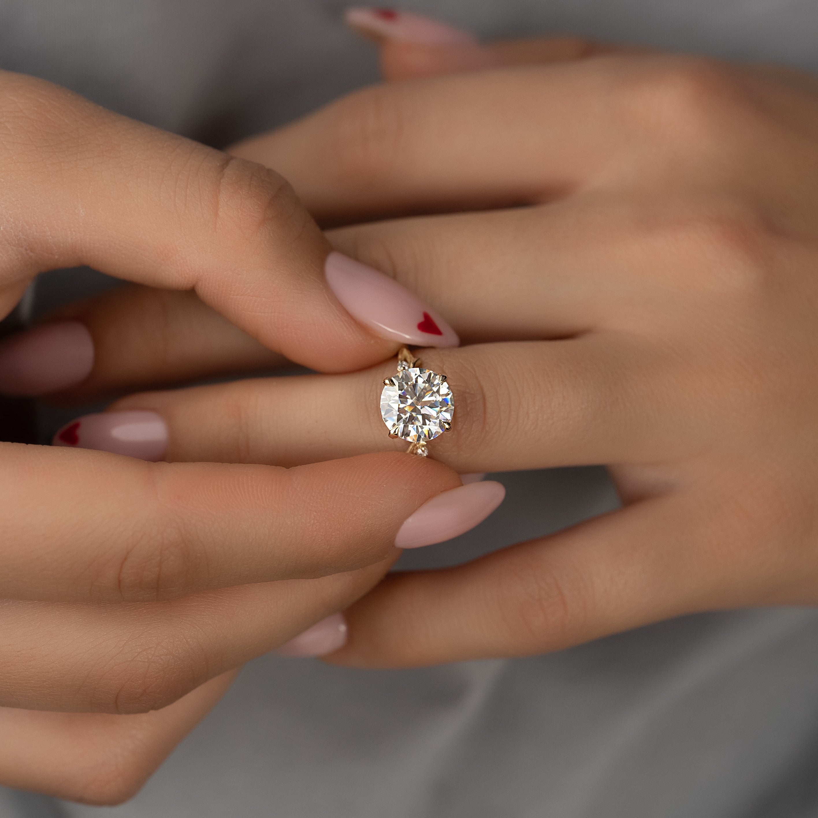 Round cut CVD diamond engagement ring with twig-inspired band in white gold