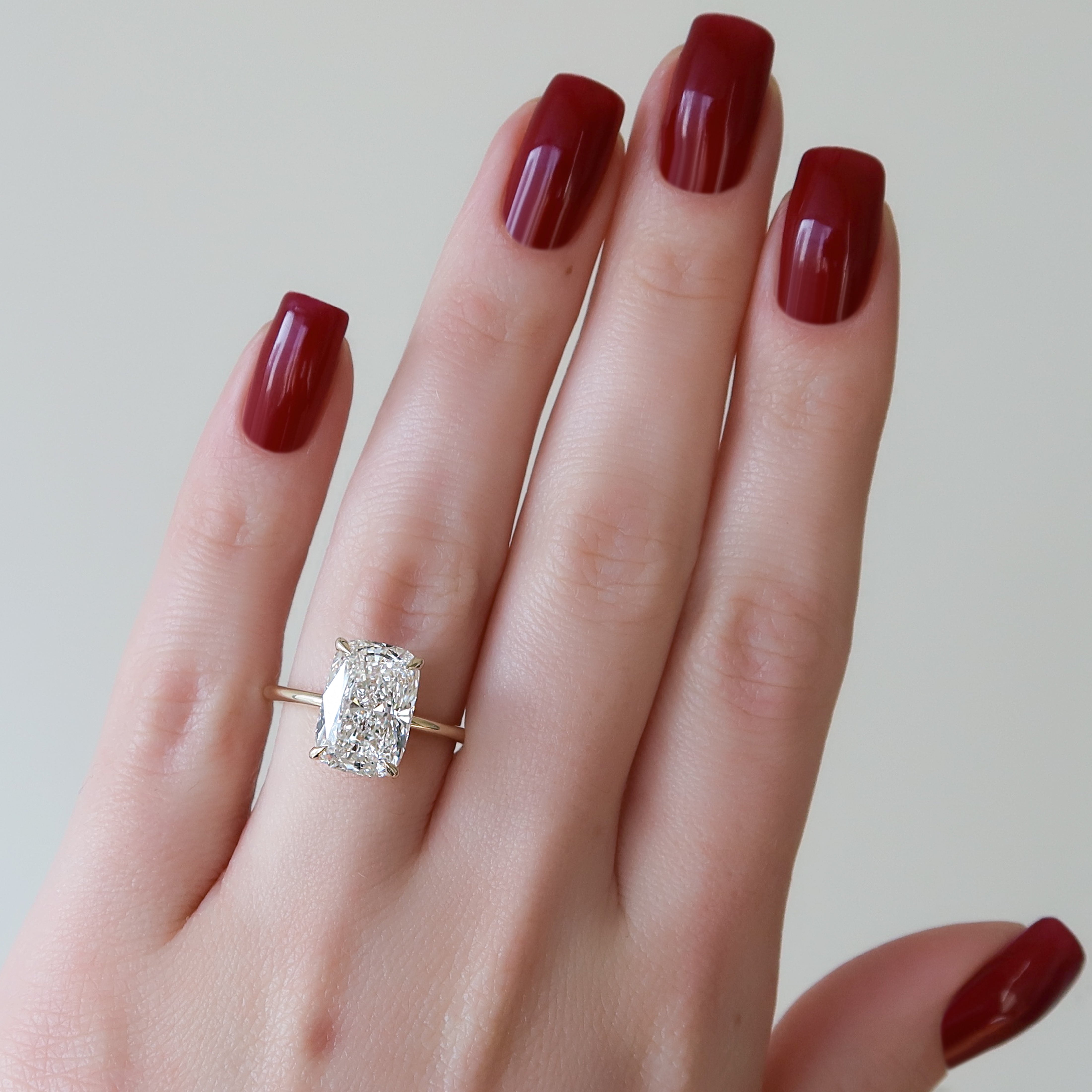 Elongated cushion cut CVD diamond engagement ring with hidden halo setting in white gold