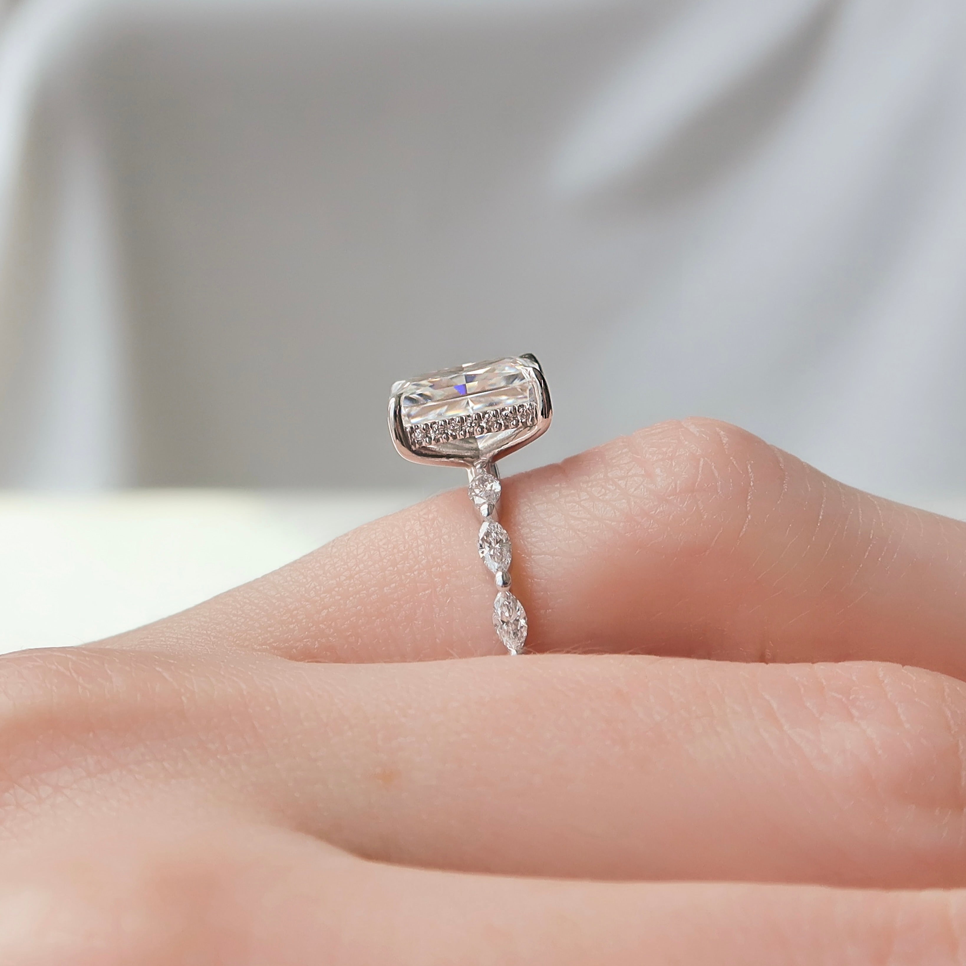 Radiant cut CVD diamond engagement ring with hidden halo and pave band in elegant solitaire-inspired style