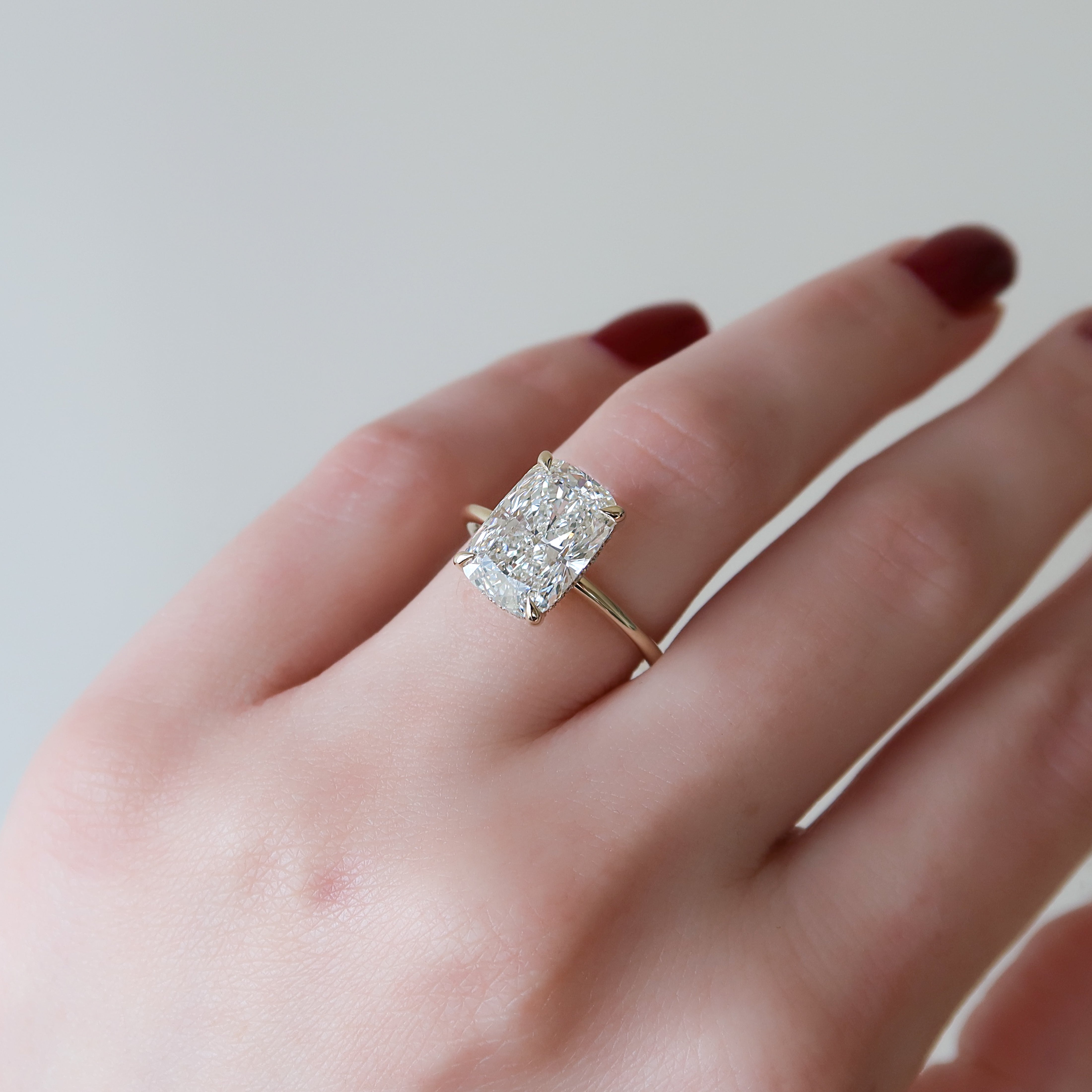 Elongated cushion cut CVD diamond engagement ring with hidden halo setting in white gold