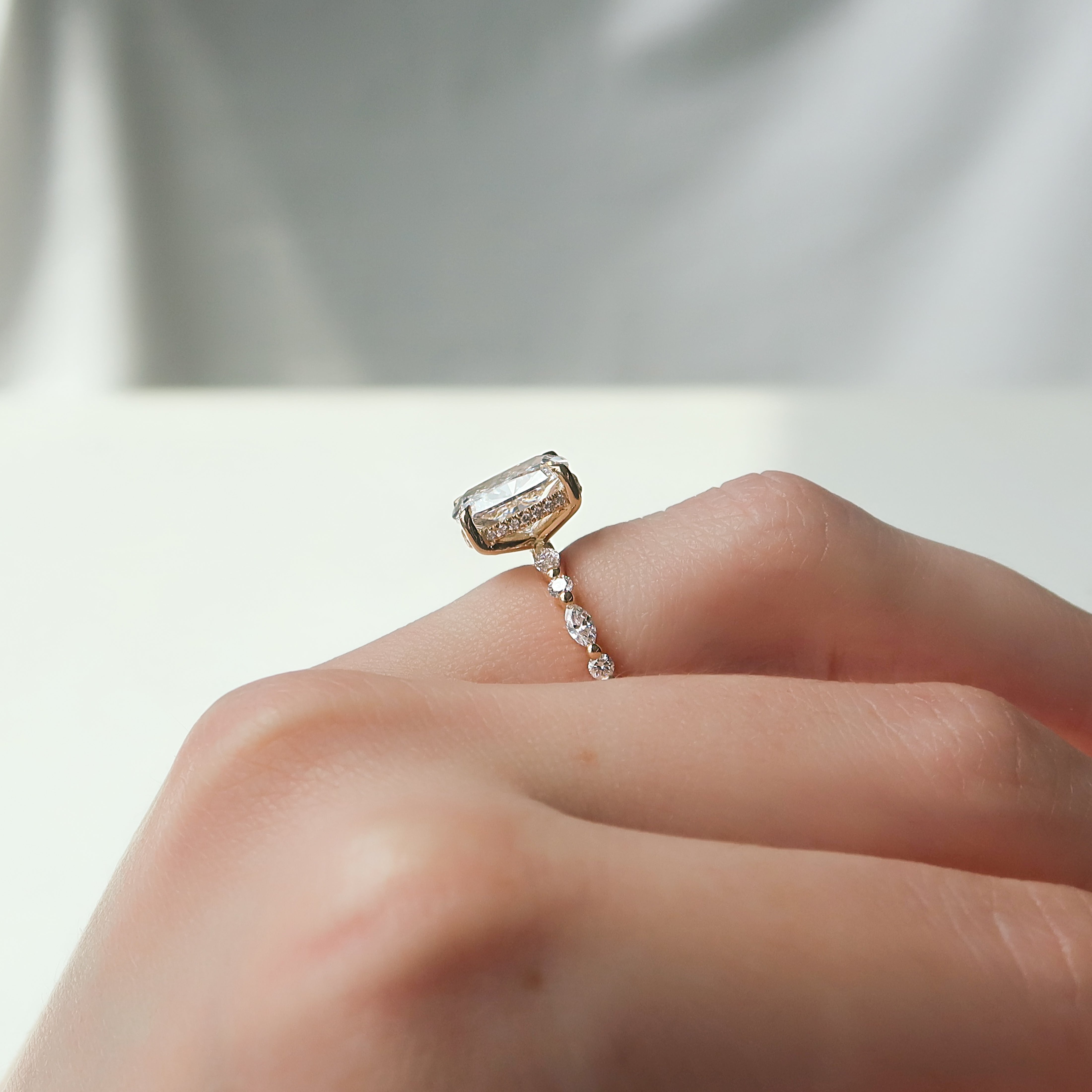 Elongated cushion cut CVD diamond hidden halo engagement ring with pave band in white gold