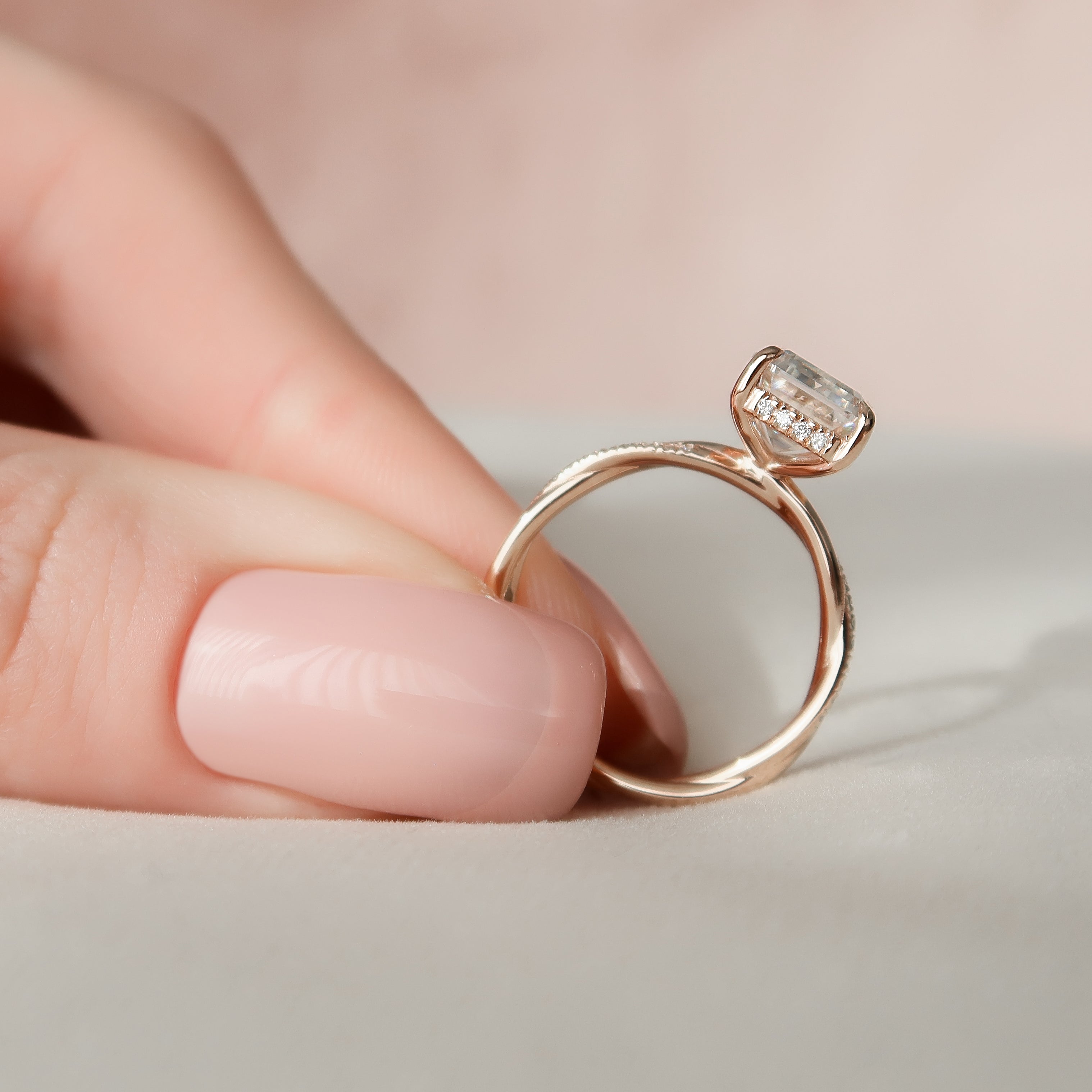 Emerald cut CVD diamond engagement ring with hidden halo and pave diamond band in platinum setting