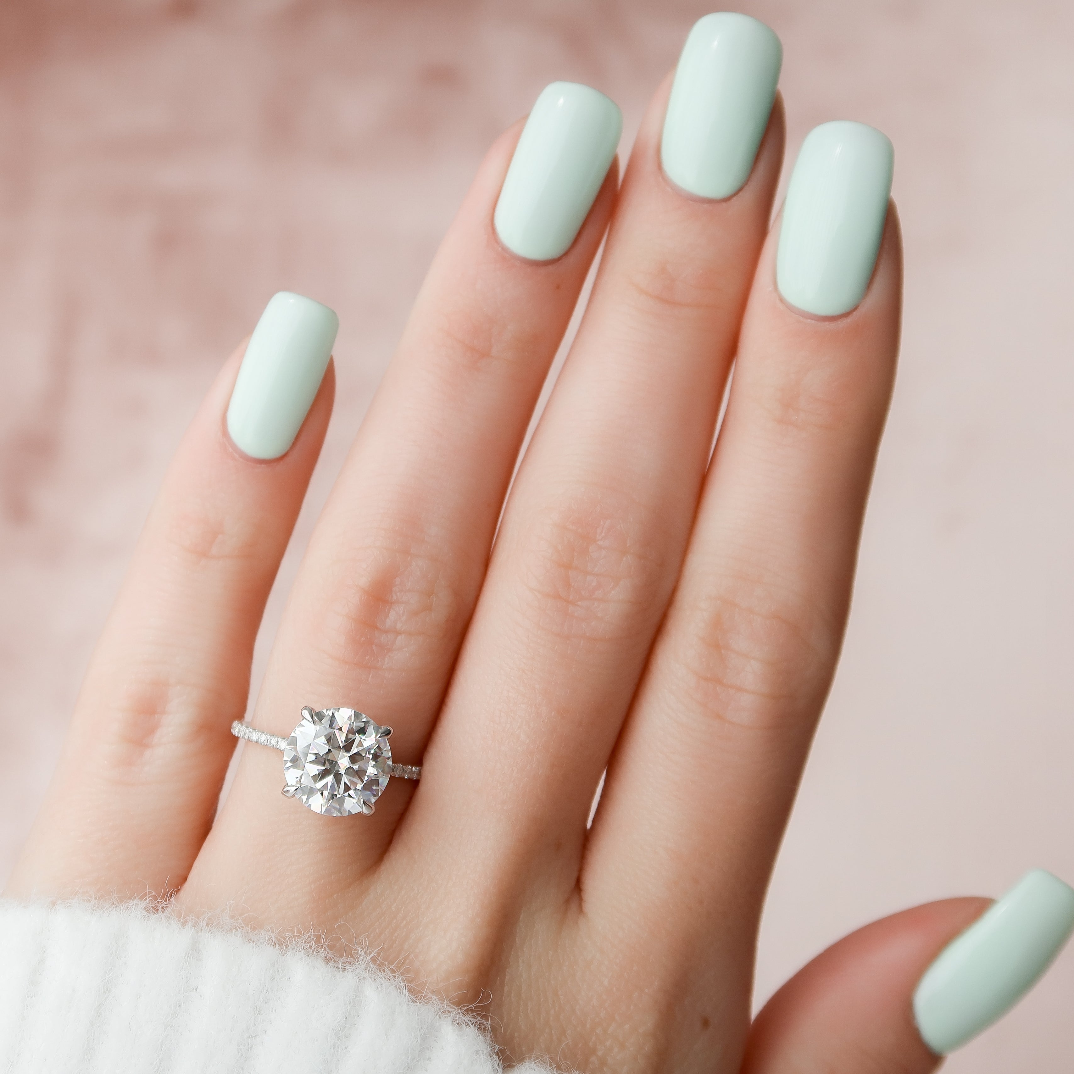 Round cut CVD diamond hidden halo engagement ring with pave band in white gold setting