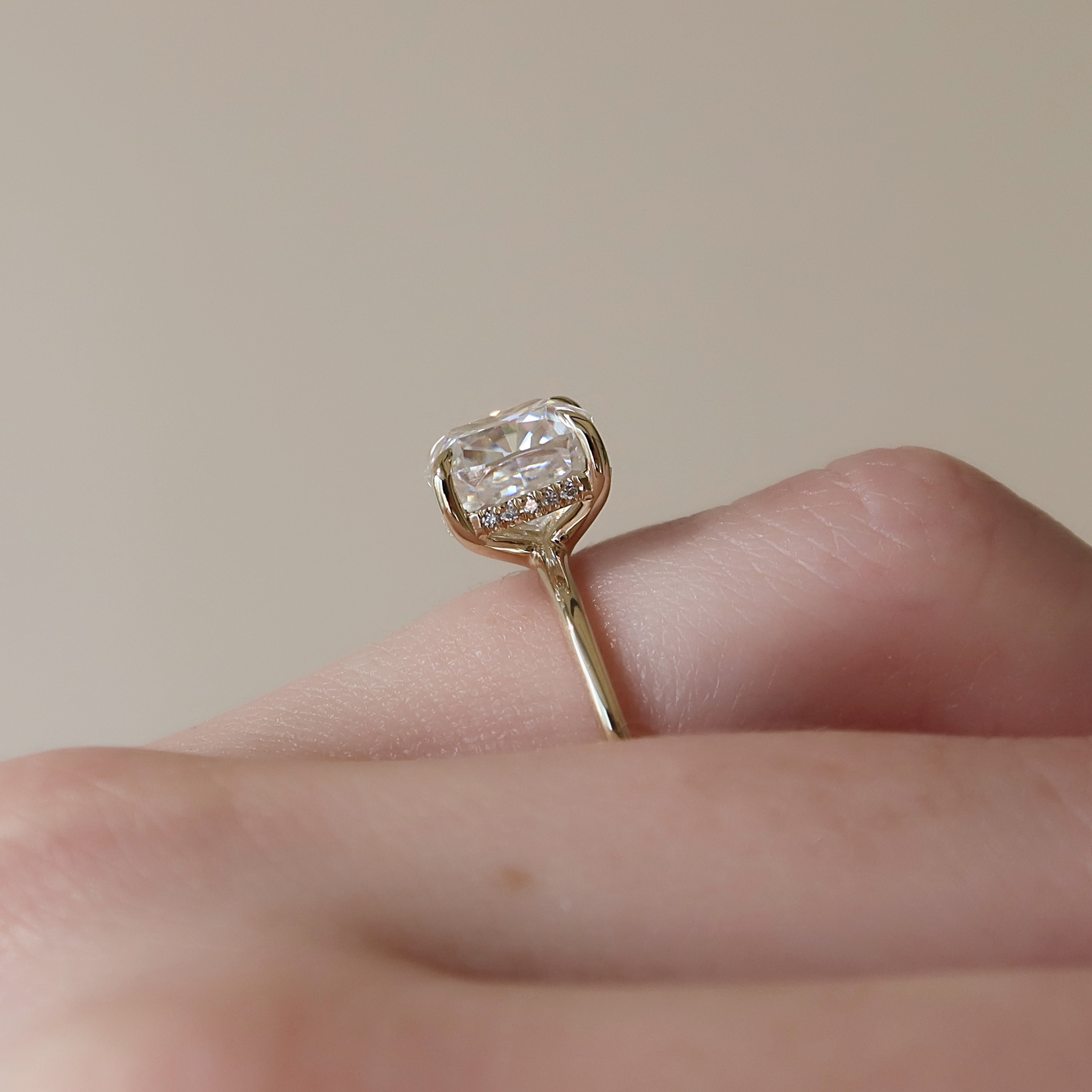 Cushion cut CVD diamond hidden halo engagement ring in platinum setting