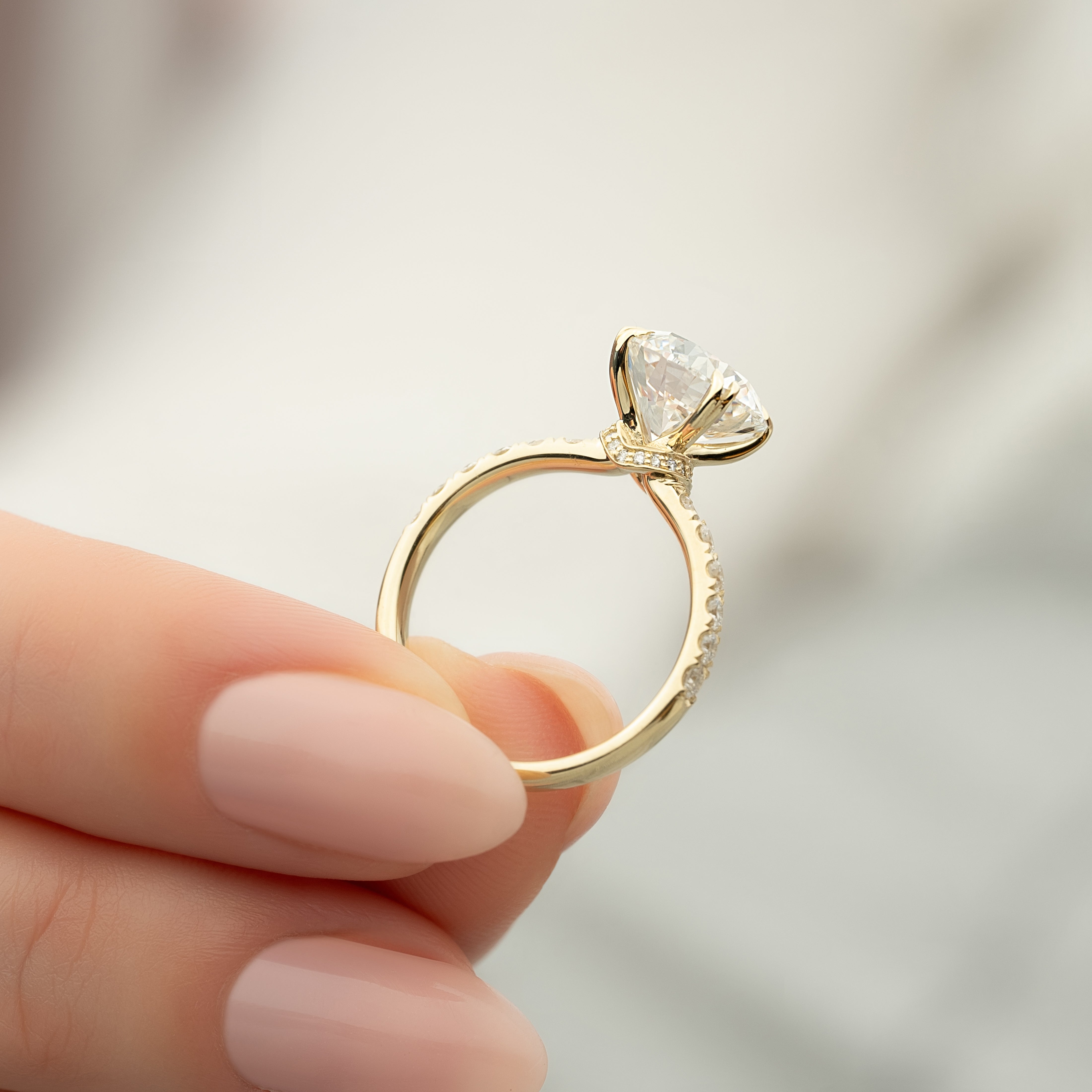 Round cut CVD diamond hidden halo engagement ring with pave band in white gold