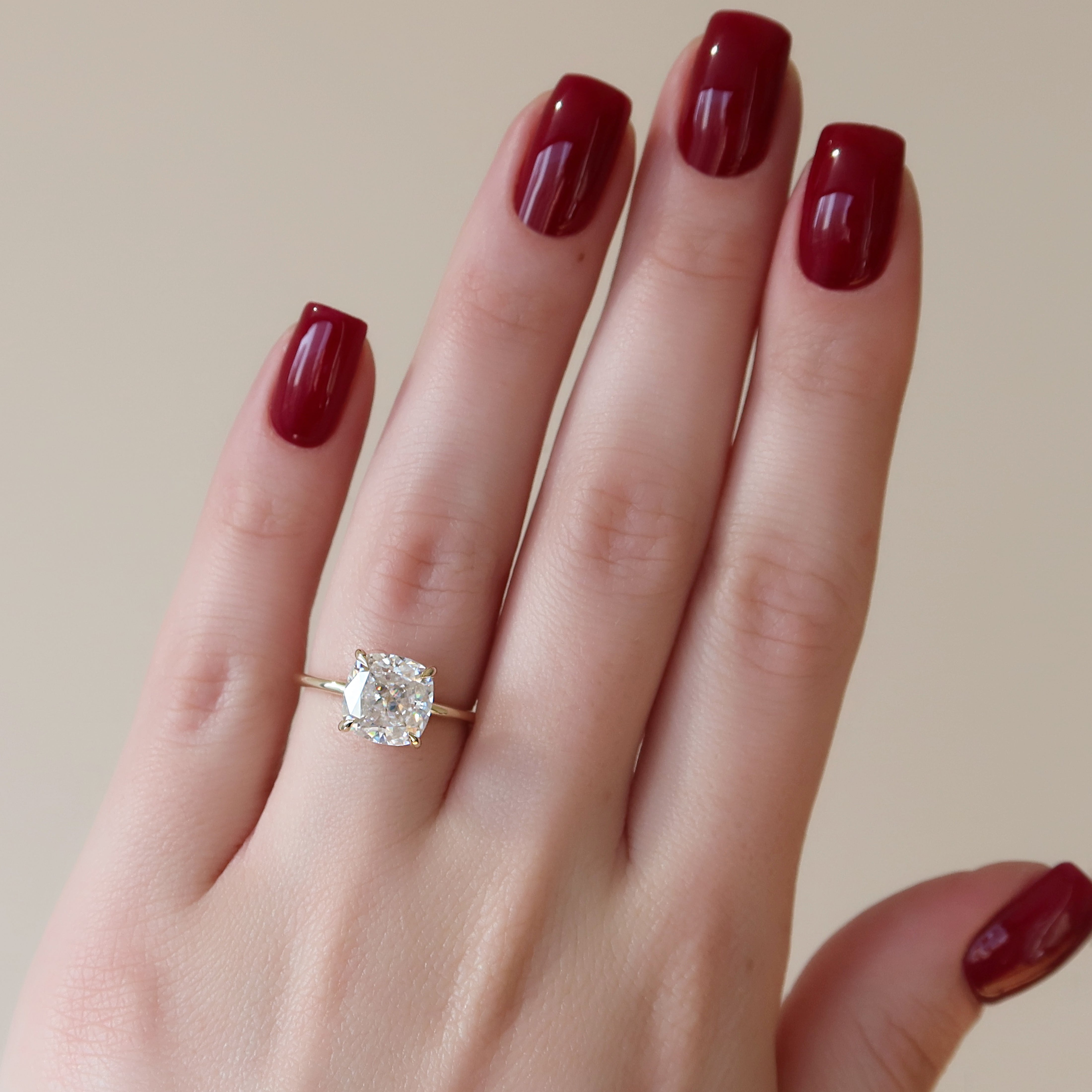 Cushion cut CVD diamond hidden halo engagement ring in platinum setting