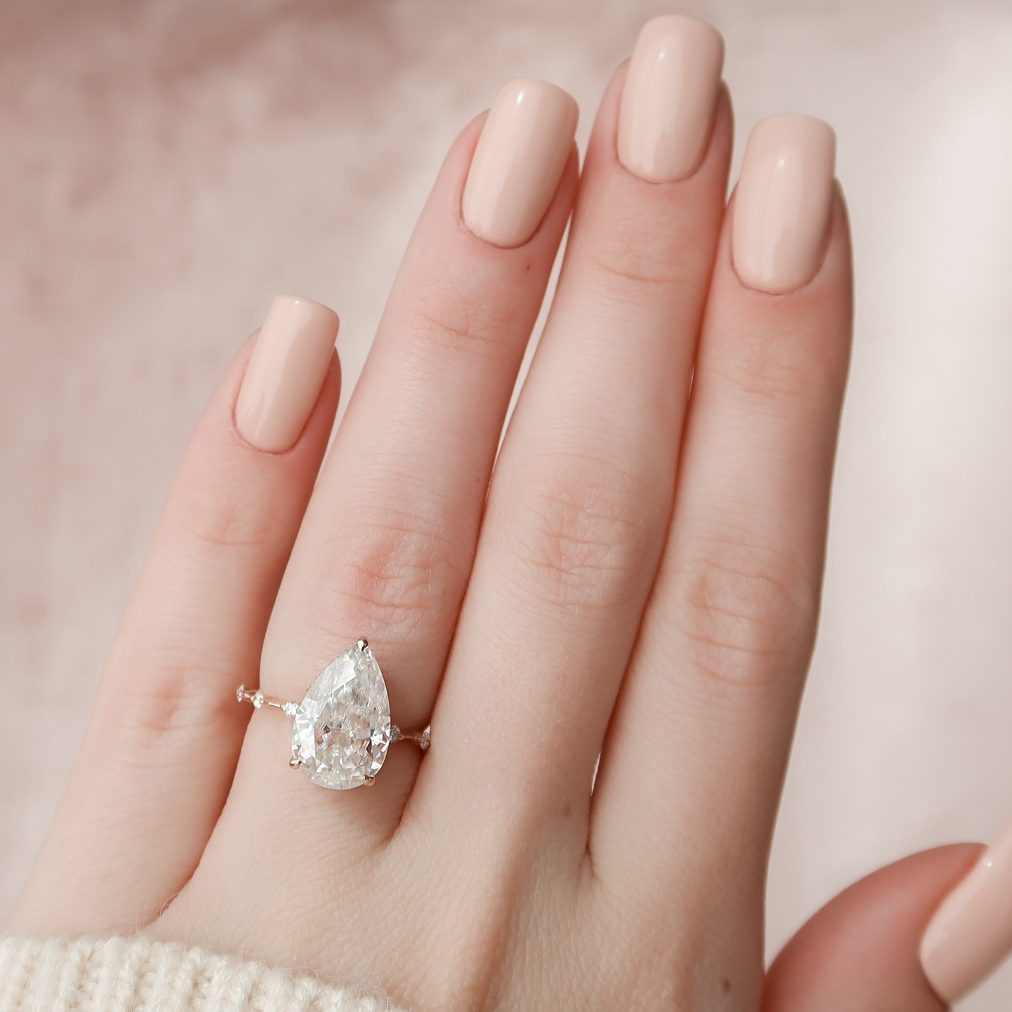 Pear cut CVD diamond engagement ring with hidden halo and dainty pave band in white gold