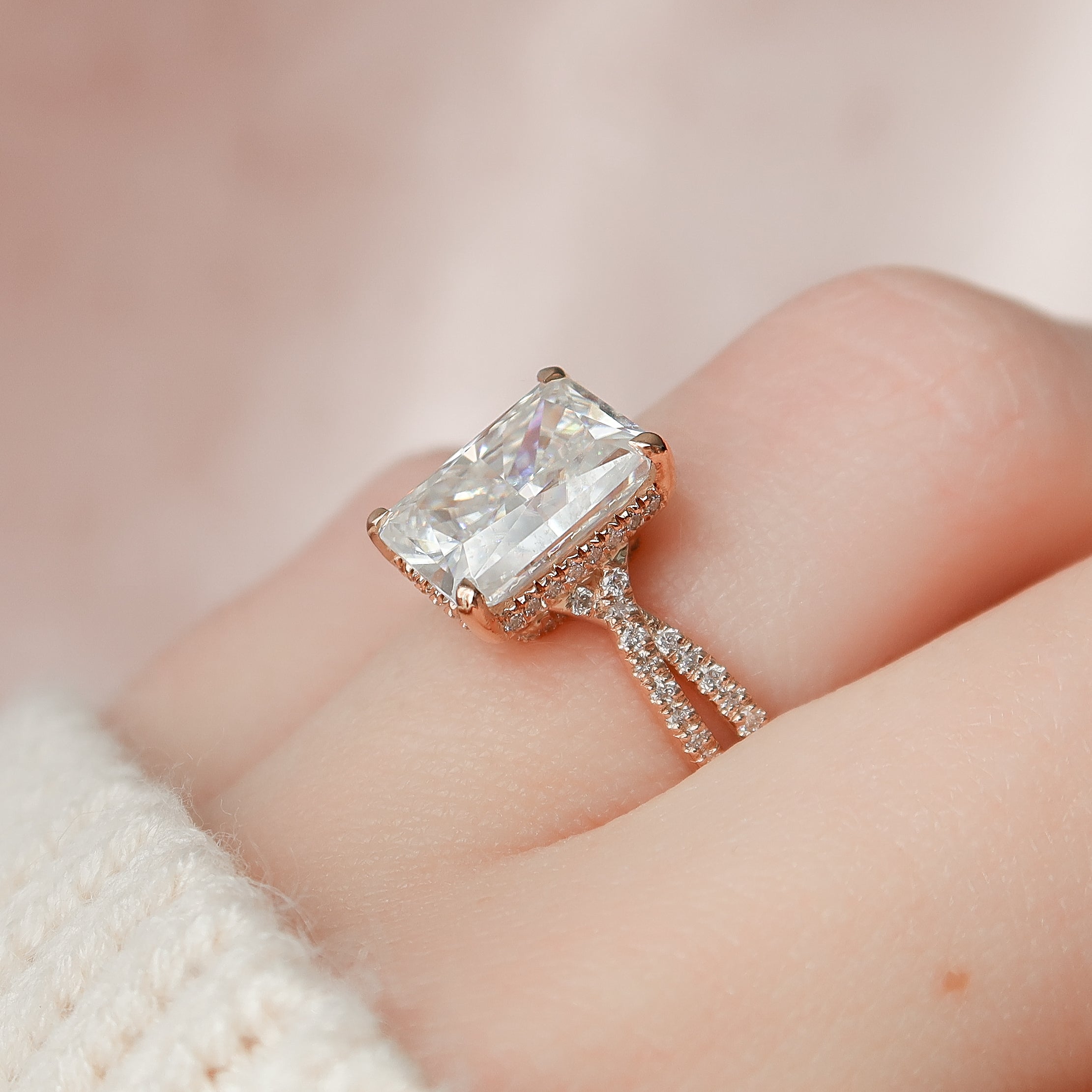 Radiant cut CVD diamond engagement ring with twisted band and hidden halo