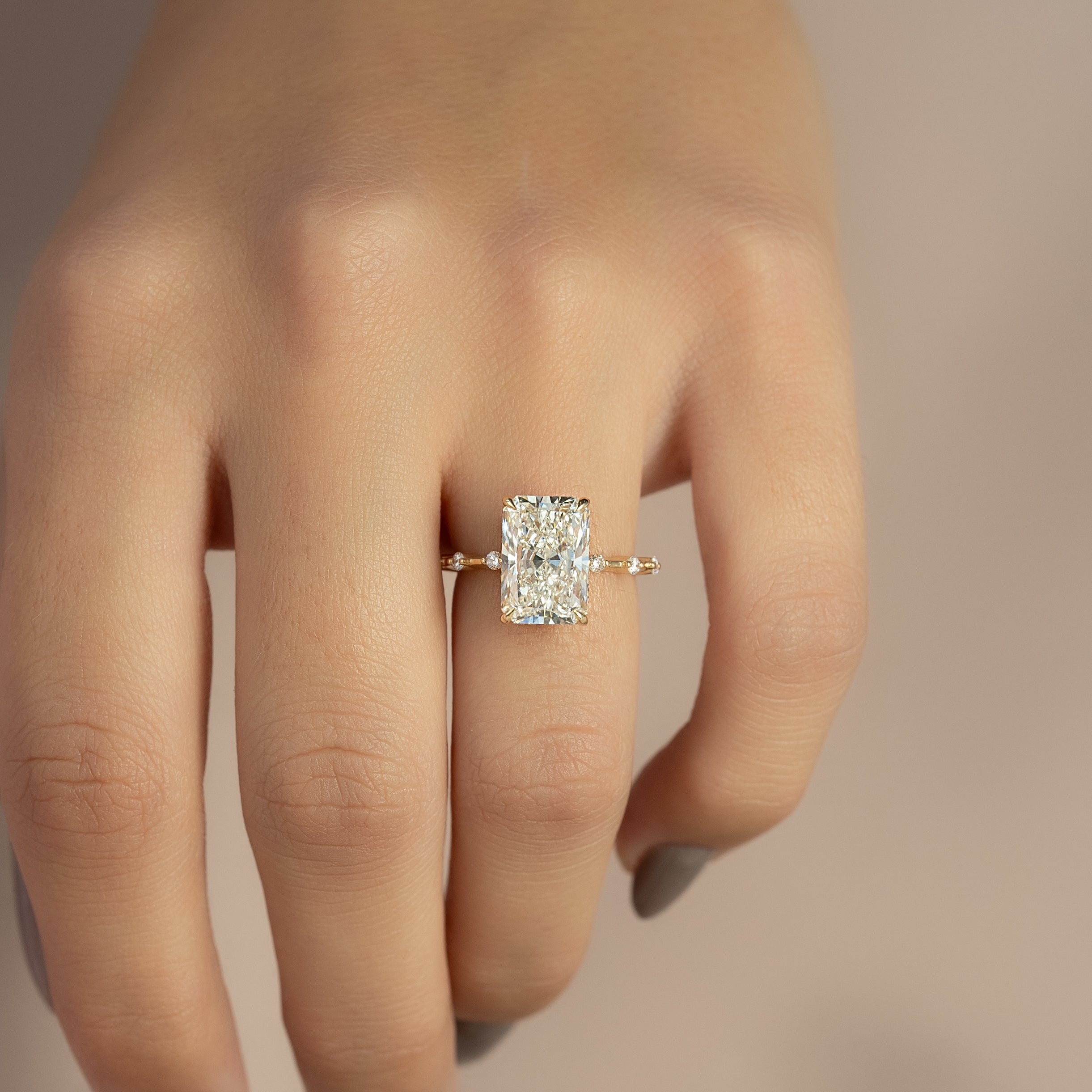 Radiant cut CVD diamond engagement ring with hidden halo in dainty platinum setting