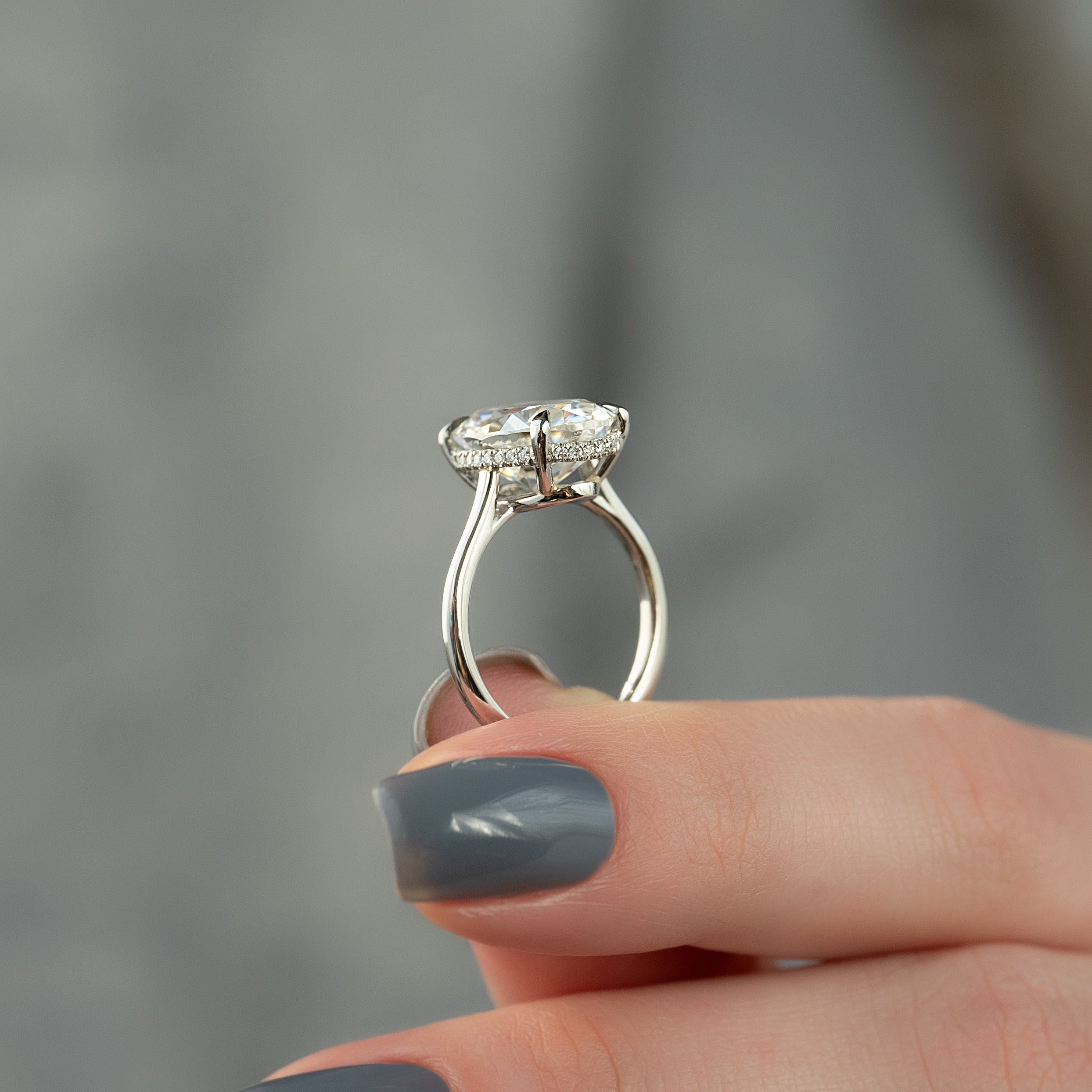 Oval cut CVD diamond engagement ring with hidden halo in white gold setting