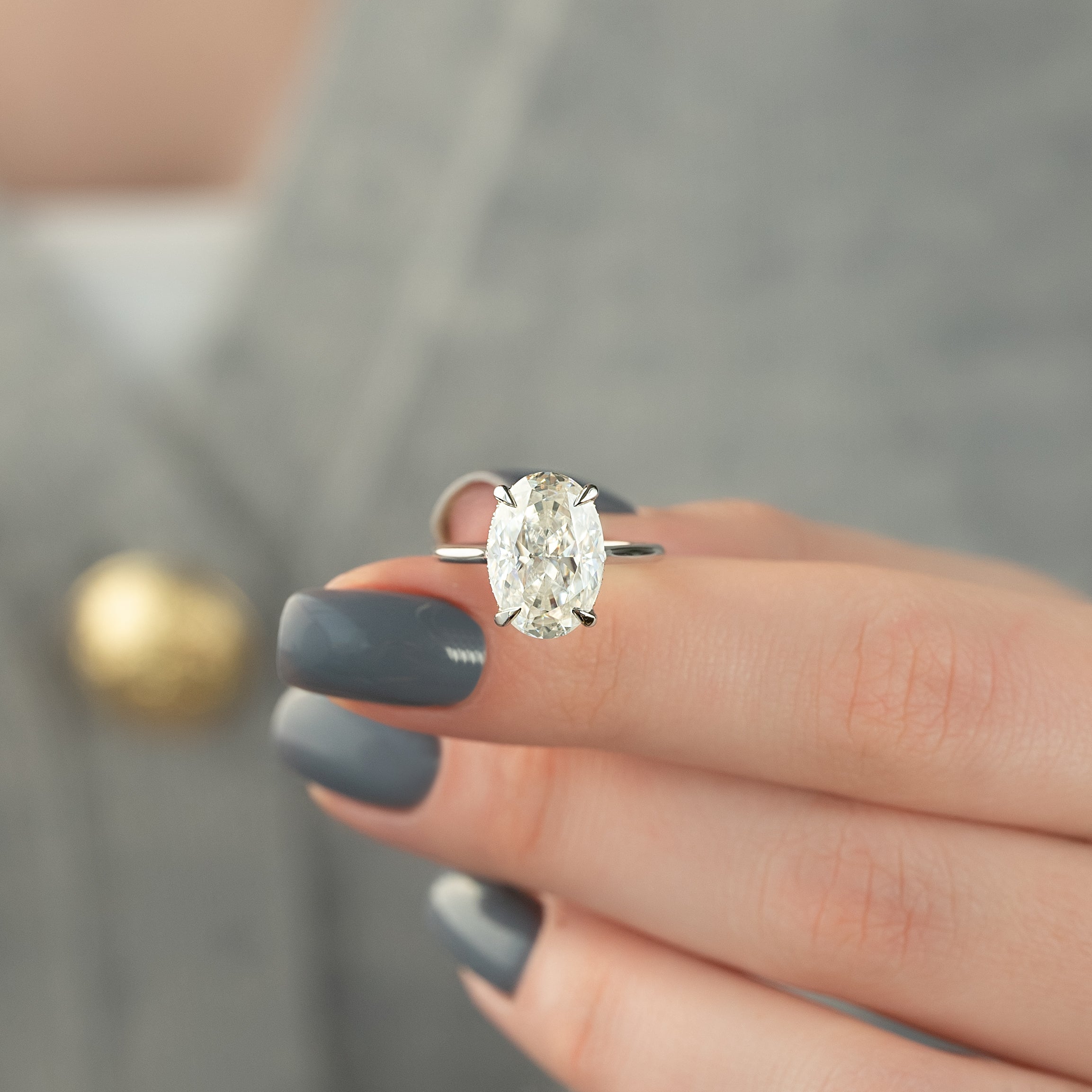 Oval cut CVD diamond engagement ring with hidden halo in white gold setting