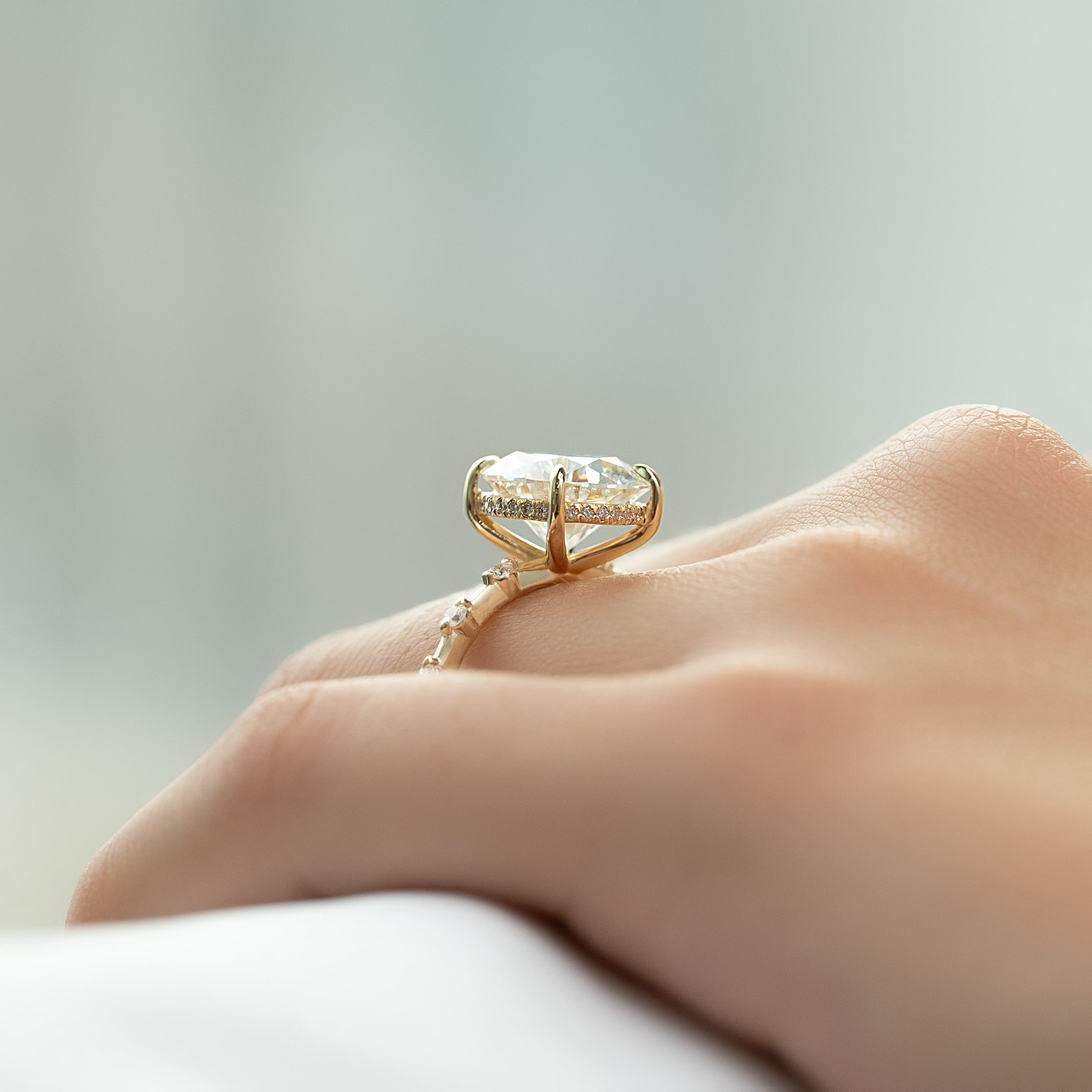 Round cut CVD diamond engagement ring with hidden halo and pave band in white gold