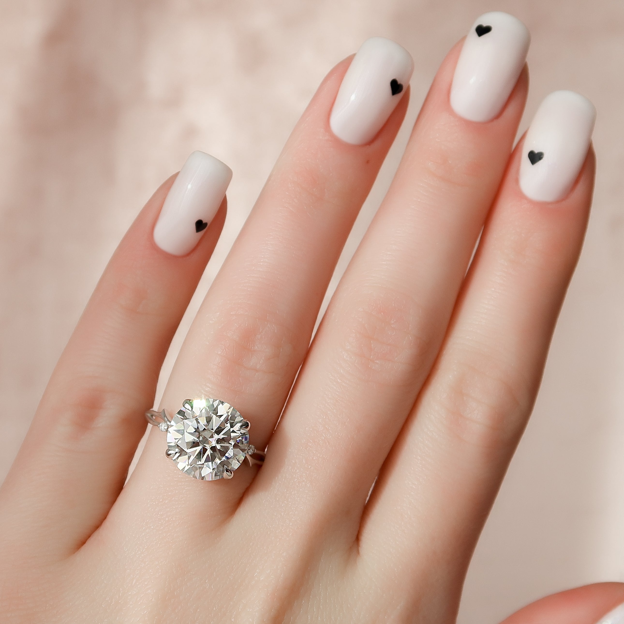 Round cut CVD diamond engagement ring with twig-inspired band in white gold