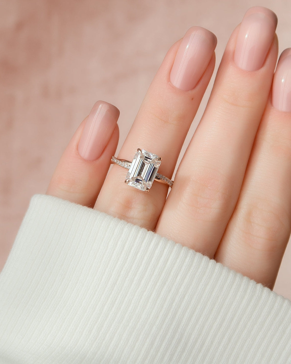 Emerald cut CVD diamond engagement ring with hidden halo and pave diamond band in platinum setting