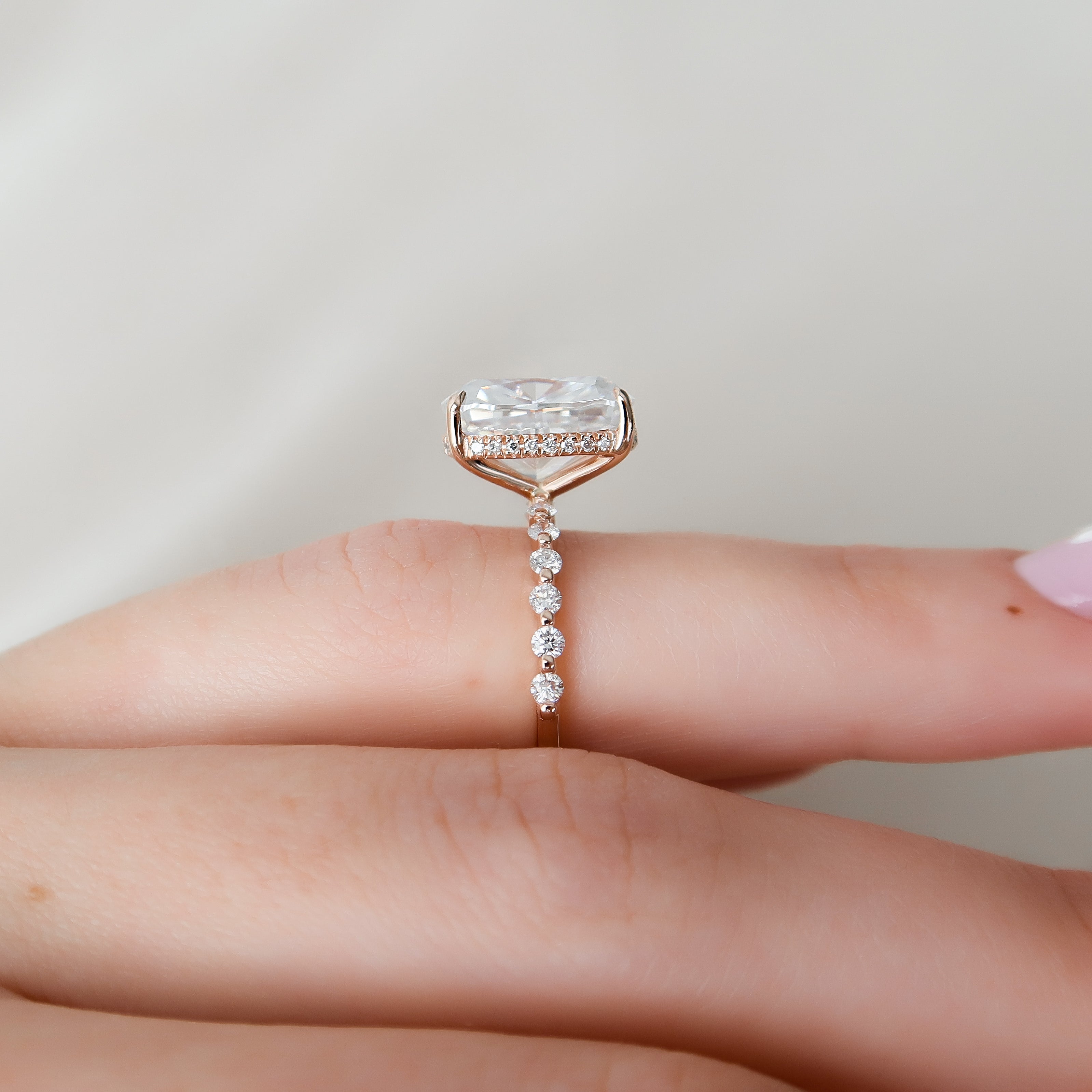 Elongated cushion cut CVD diamond ring with hidden halo and pave style band in platinum