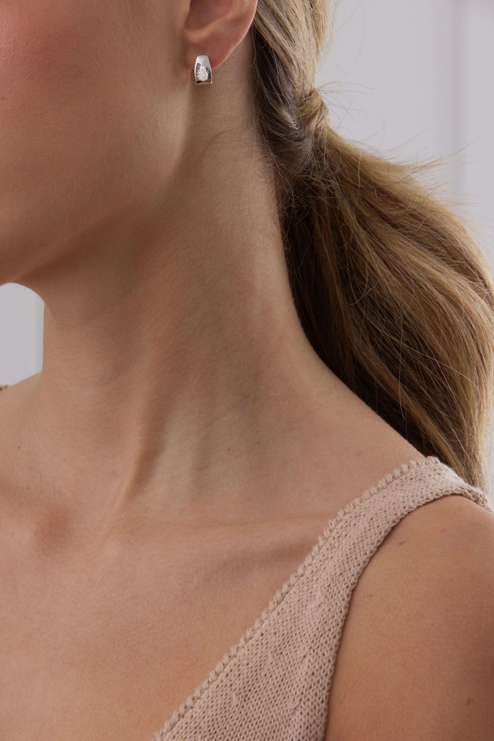 0.14 TCW Round Moissanite Diamond Huggie Earrings - Camila Brown