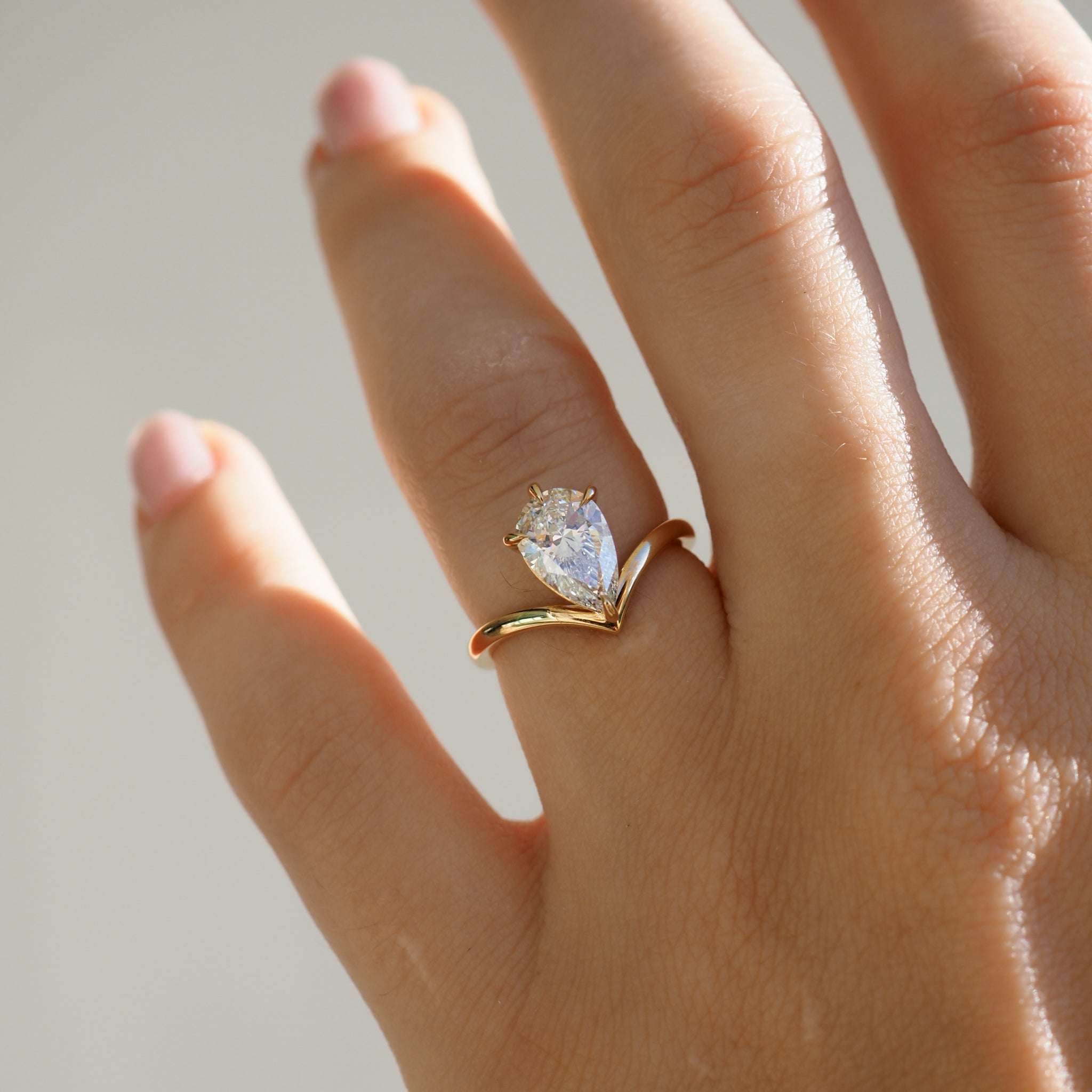 Pear shaped moissanite solitaire engagement ring in white gold setting, 1.50-2.50 carats
