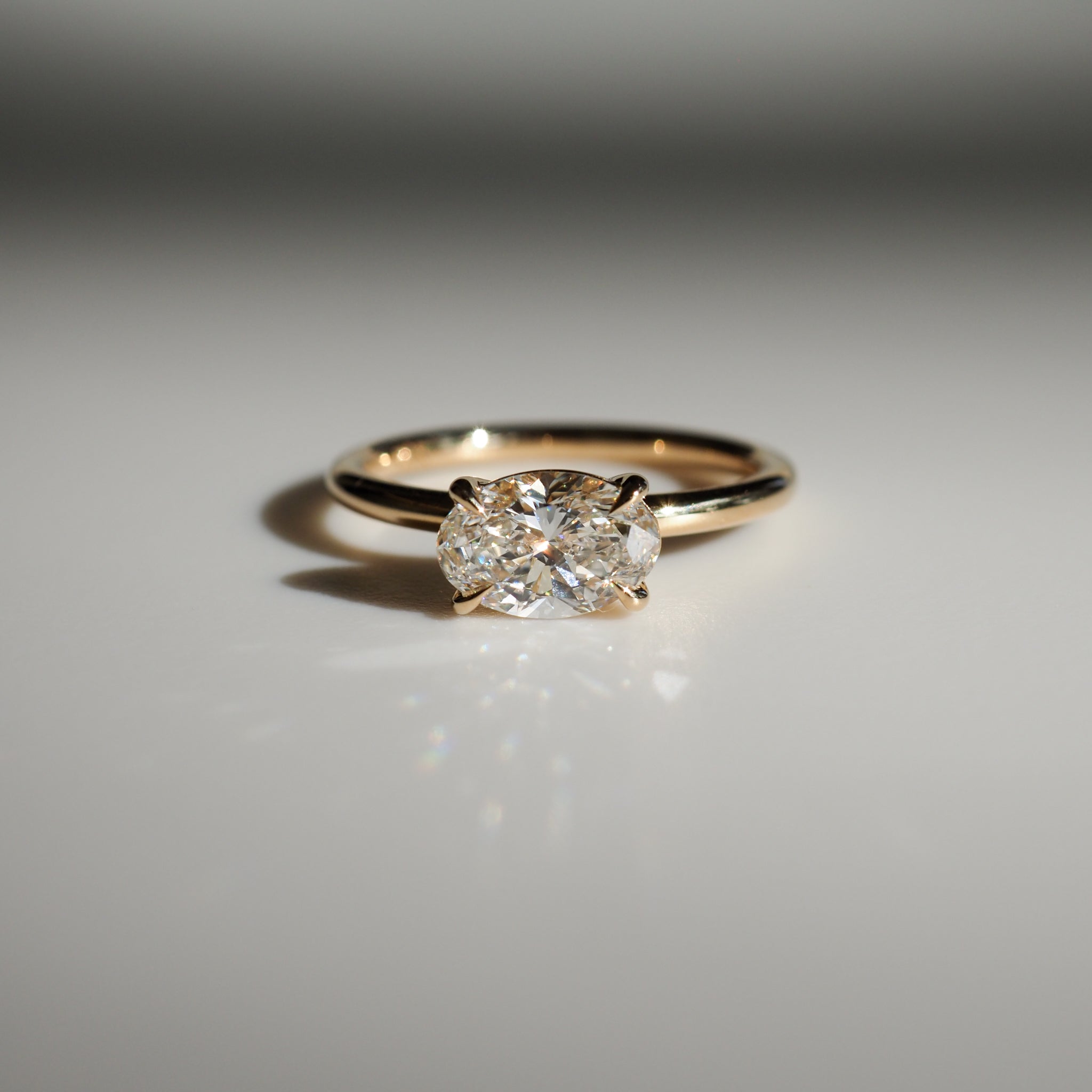 East-west elongated oval moissanite solitaire engagement ring in platinum setting, 1.0-3.0 carats