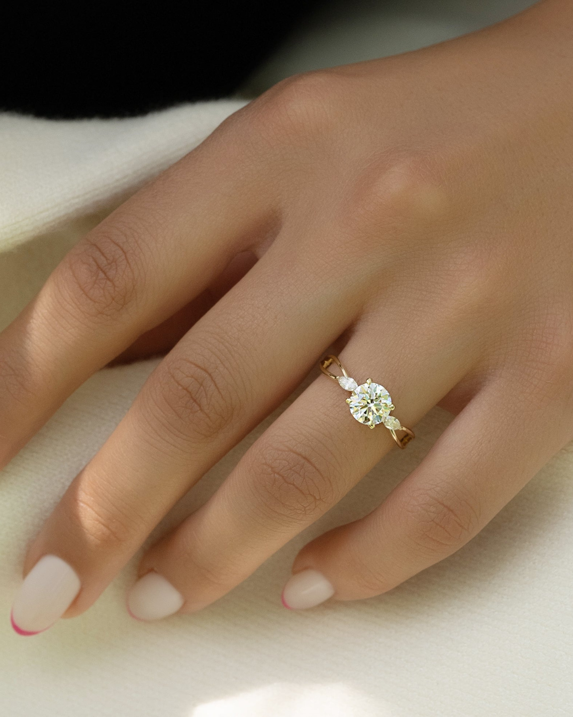 Round cut CVD diamond three stone engagement ring in white gold setting