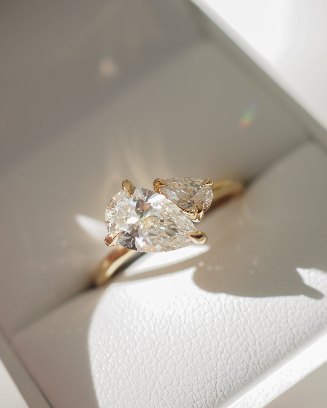 Pear cut moissanite two-stone engagement ring in platinum setting, 0.90-2.0 CT