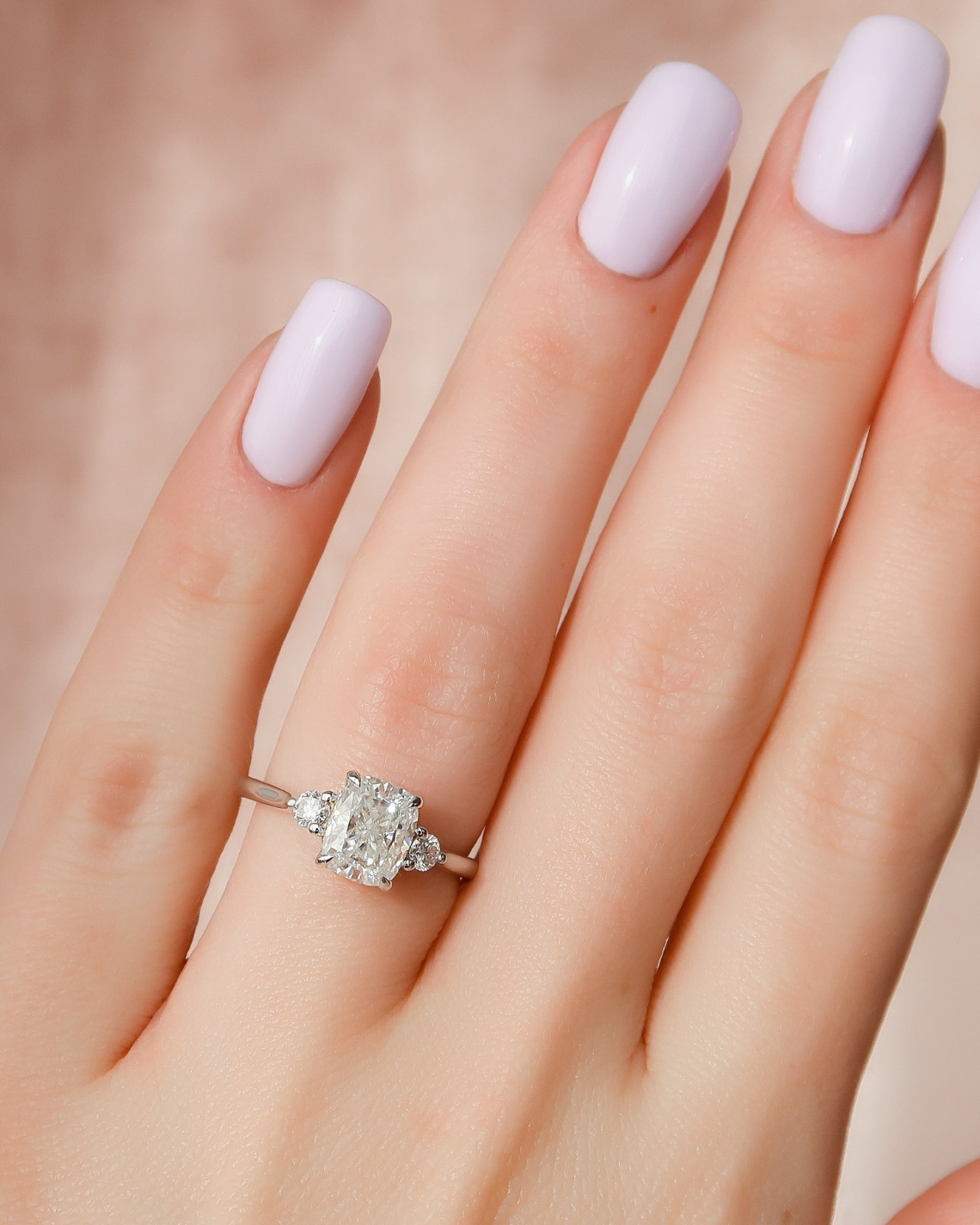 Elongated cushion cut CVD diamond three stone engagement ring in white gold