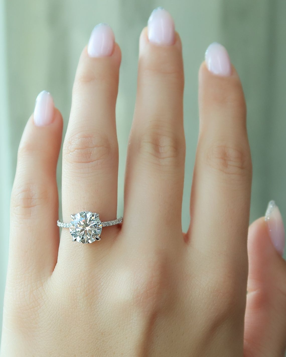 Round cut CVD diamond engagement ring with hidden halo and pave diamond band in white gold