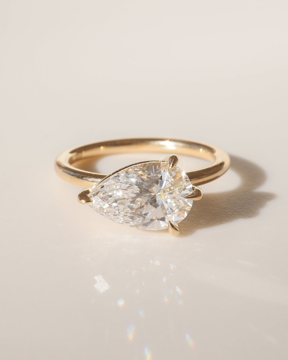 East-west pear shaped moissanite solitaire engagement ring in platinum setting, 2.0-4.0 carats