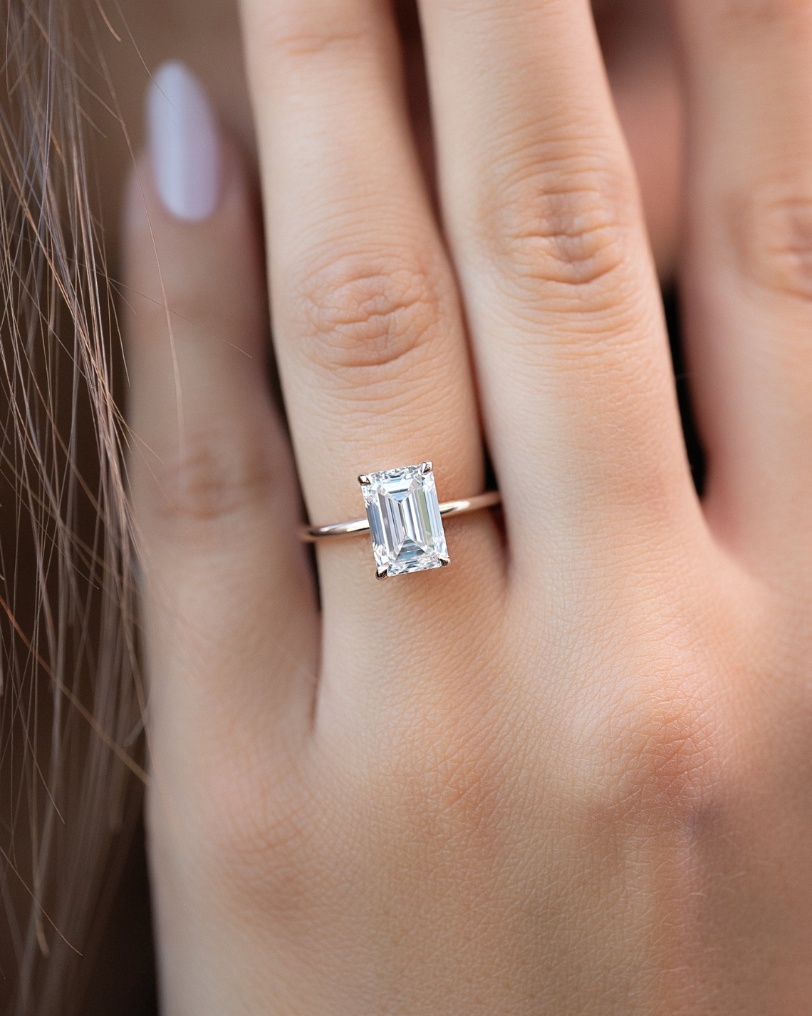 Emerald cut CVD diamond solitaire engagement ring in platinum setting