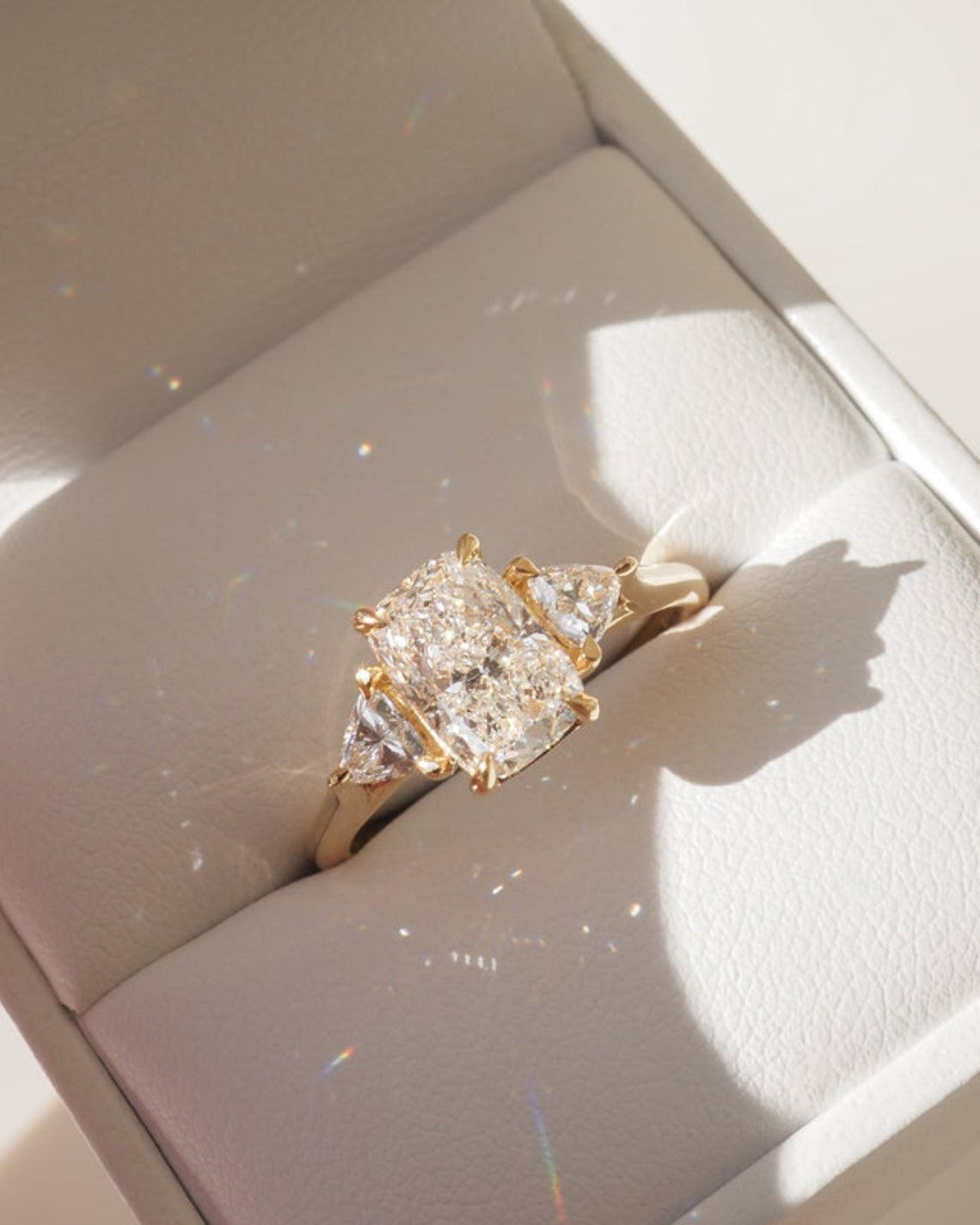 Cushion cut moissanite three-stone engagement ring in white gold setting, 1.40-2.50 CT