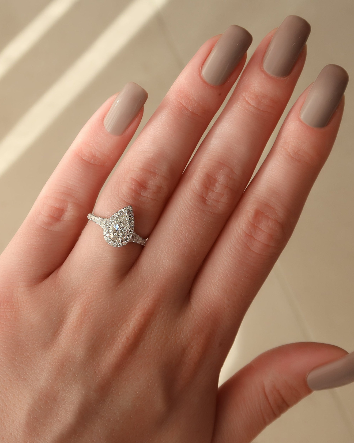Pear cut CVD diamond halo engagement ring with pave diamond band in white gold