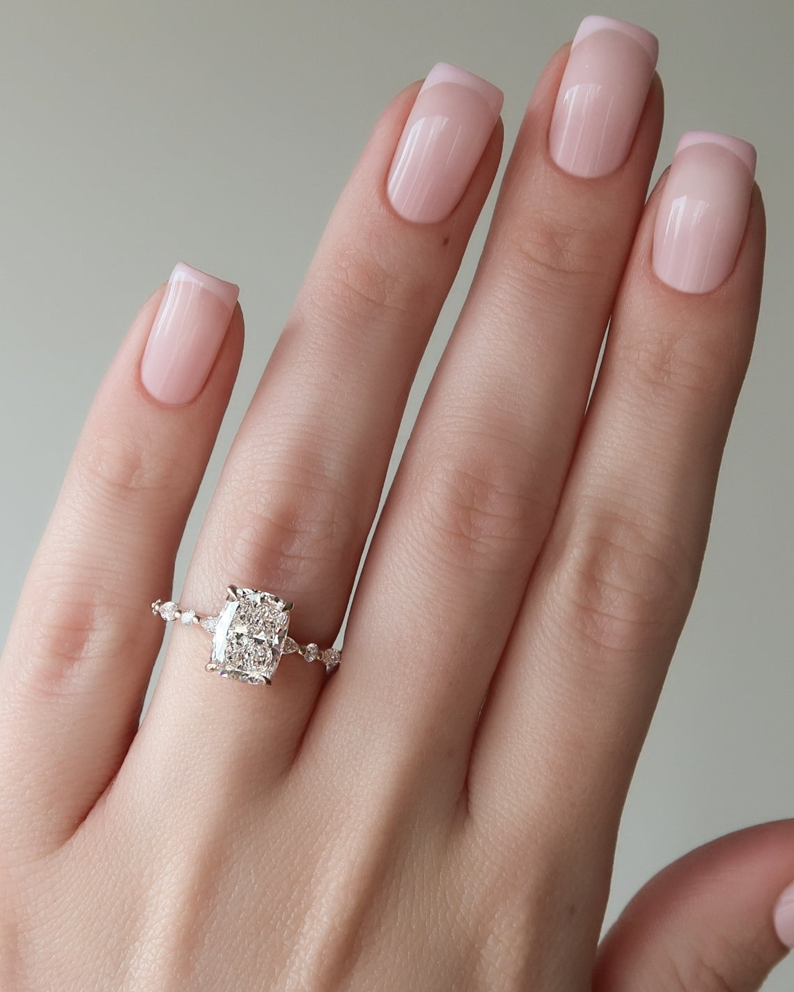 Elongated cushion cut CVD diamond hidden halo engagement ring with pave band in white gold