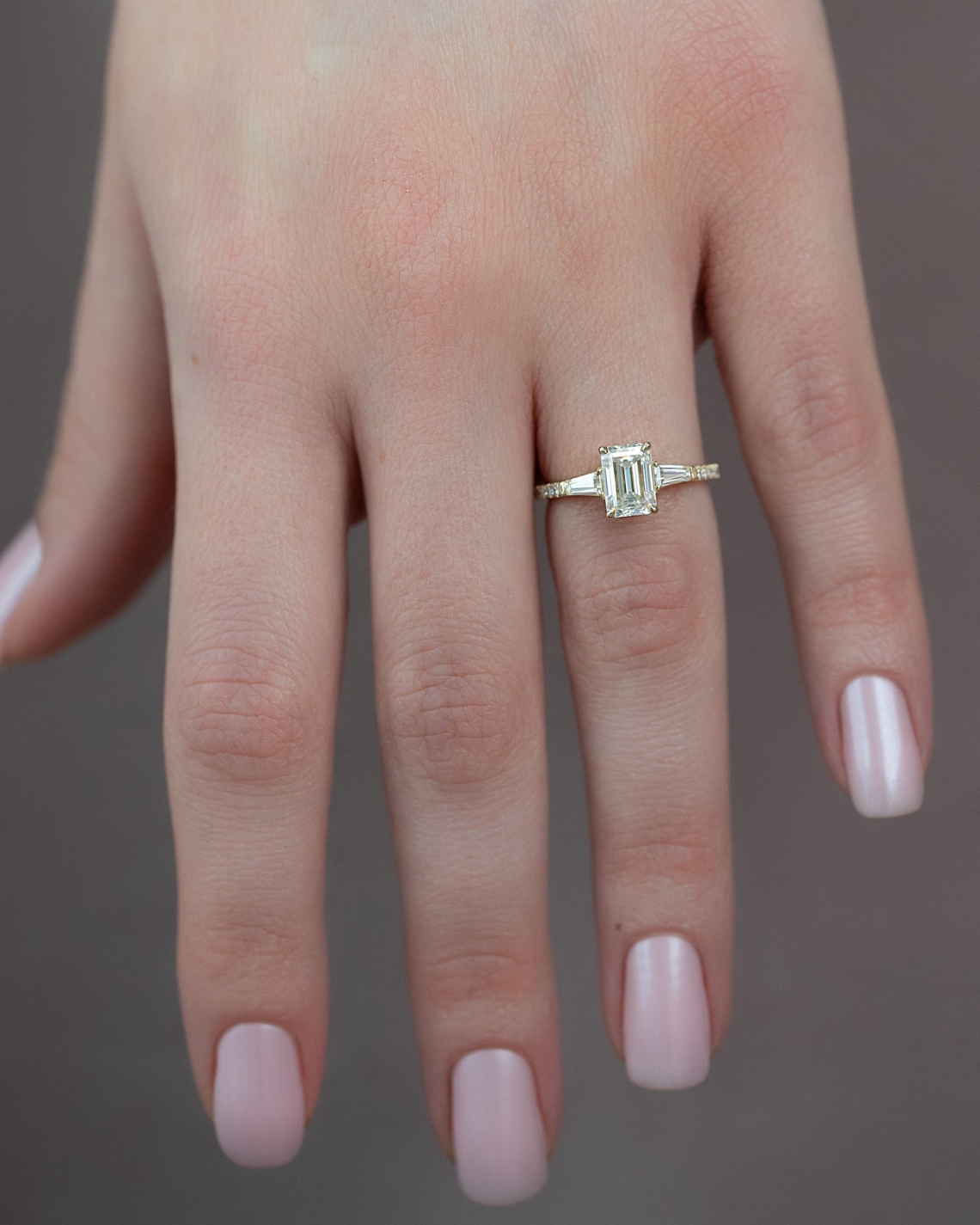 Emerald cut CVD diamond engagement ring with pave band in white gold