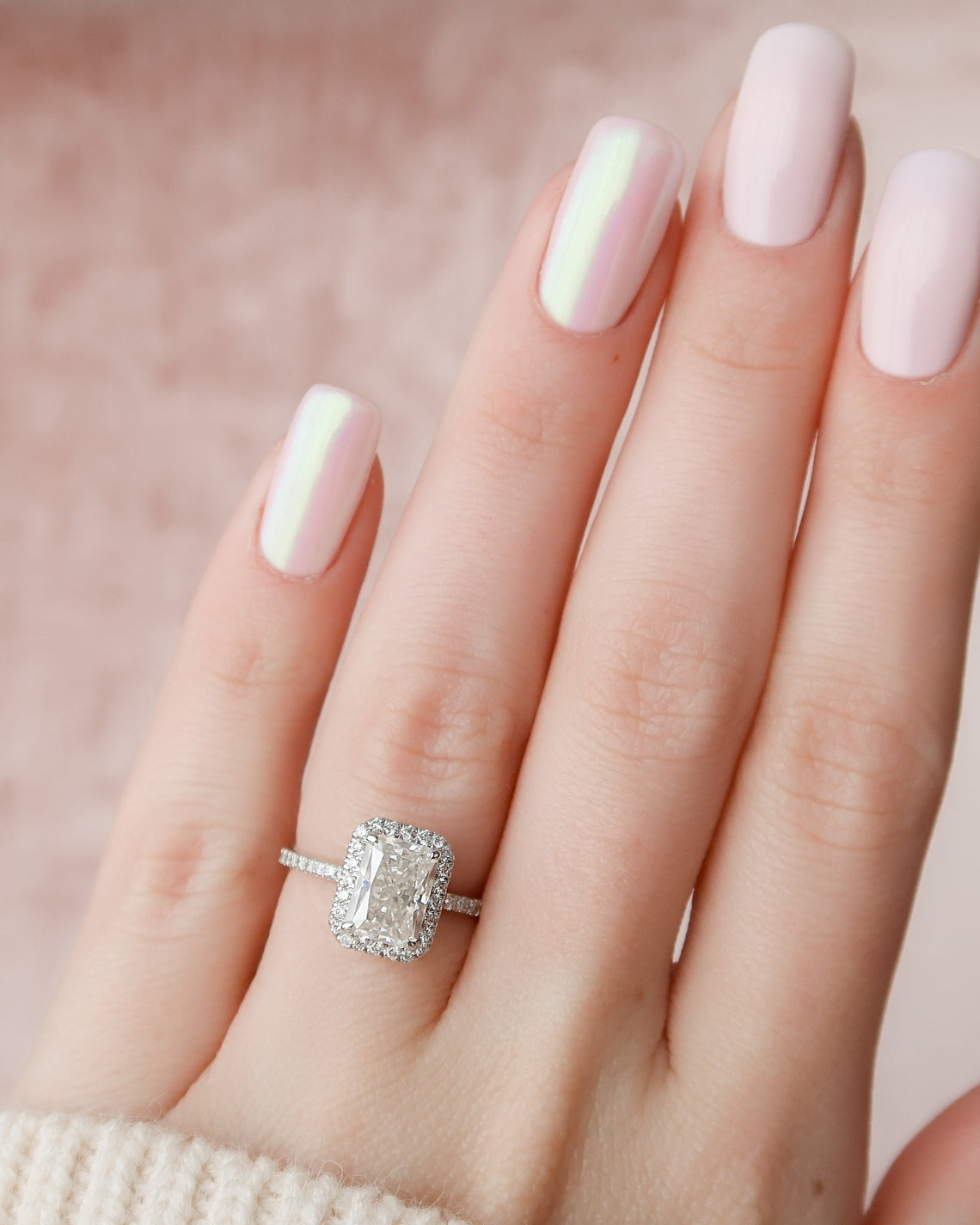 Radiant cut CVD diamond engagement ring with halo setting and pave band, crafted in a modern elegant style