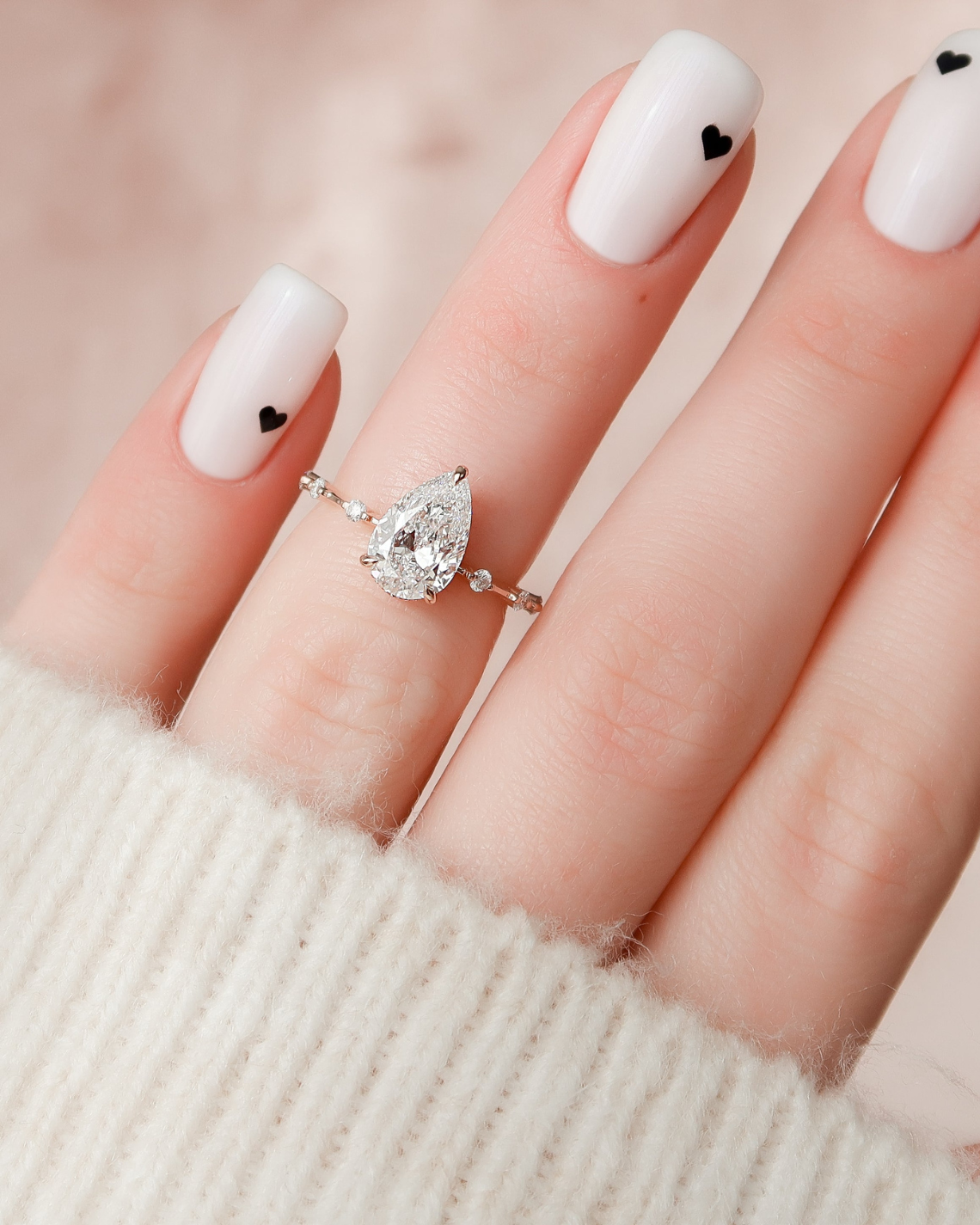 Pear cut CVD diamond engagement ring with hidden halo and dainty pave band in white gold