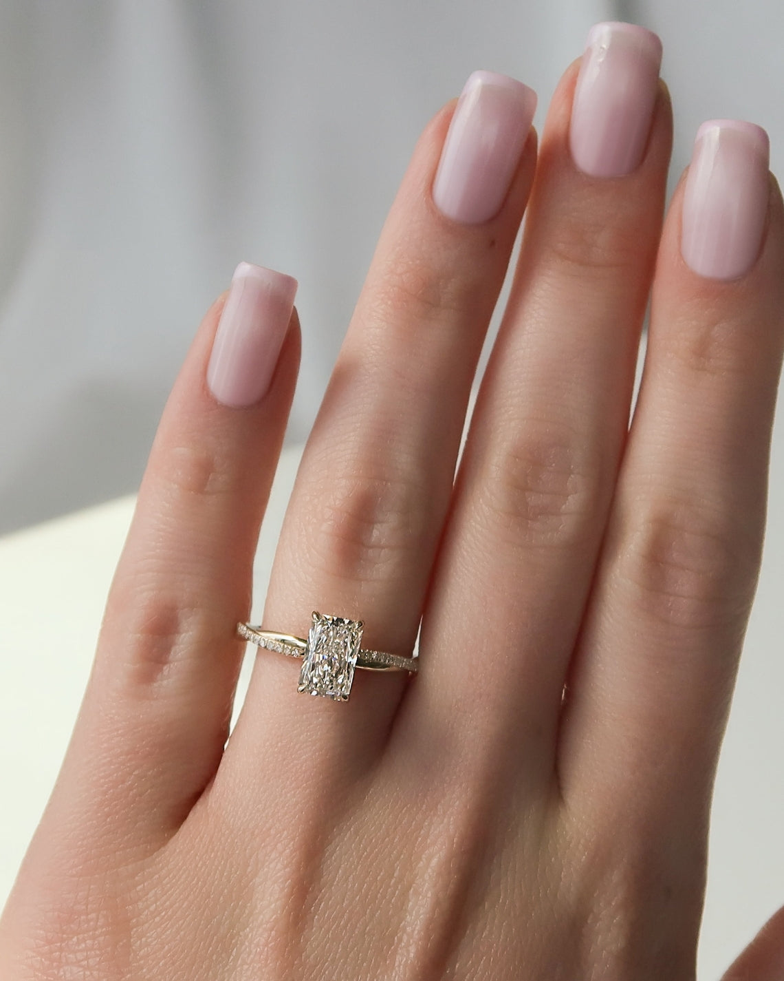 Radiant cut CVD diamond twisted pave engagement ring in white gold setting