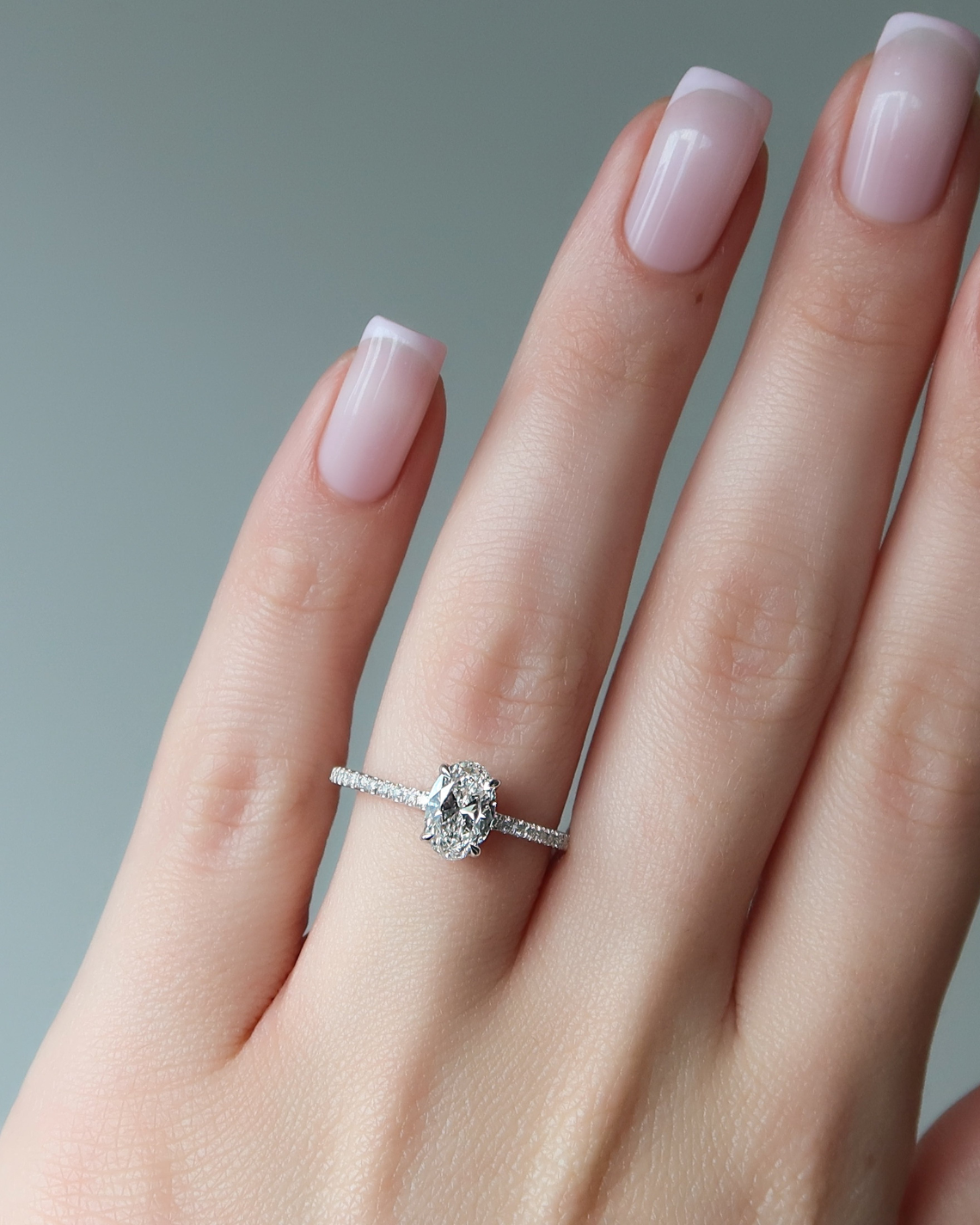 Oval cut CVD diamond pave engagement ring with slim diamond band in white gold