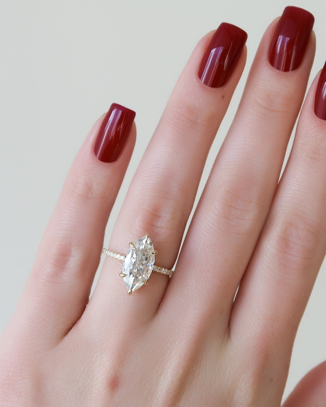 Marquise cut CVD diamond engagement ring with hidden halo and pave diamond band in white gold