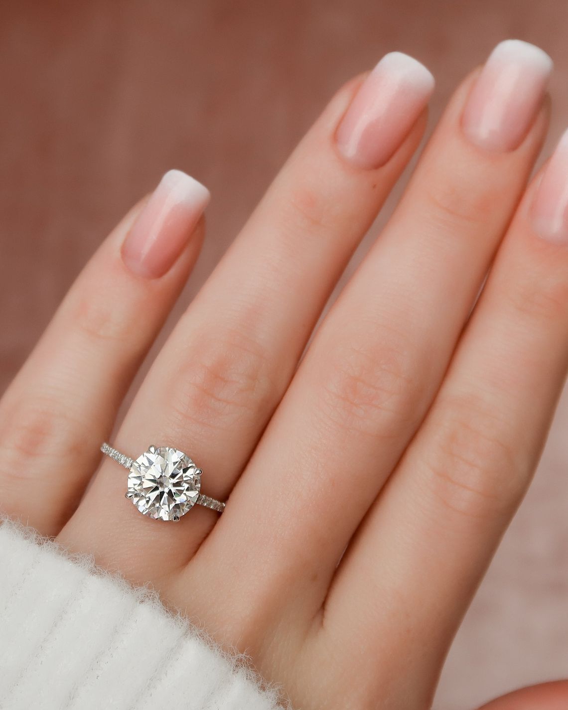 Round cut CVD diamond engagement ring with hidden halo and pave diamond band in white gold