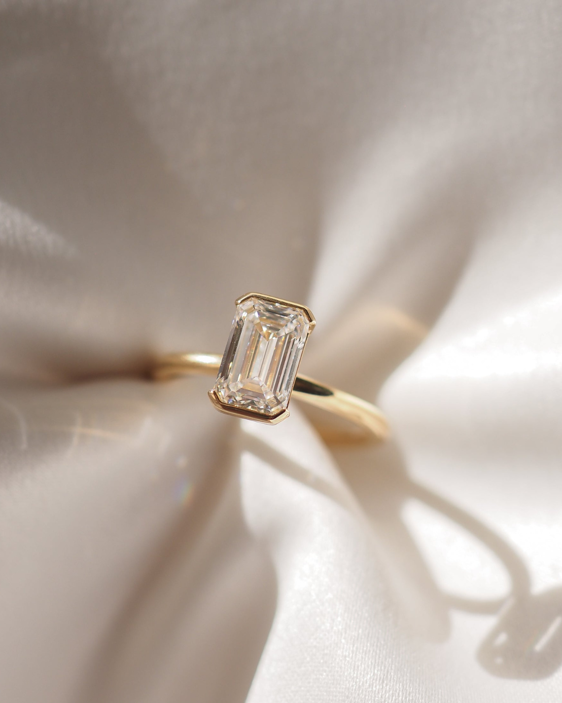 Emerald cut moissanite bezel solitaire engagement ring in platinum setting, 1.50-2.50 CT