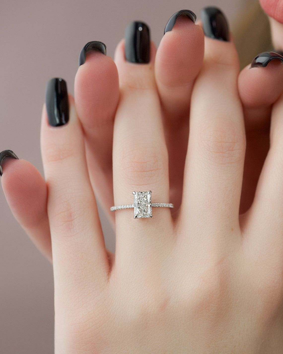 Radiant cut moissanite engagement ring with hidden halo and pave setting in platinum