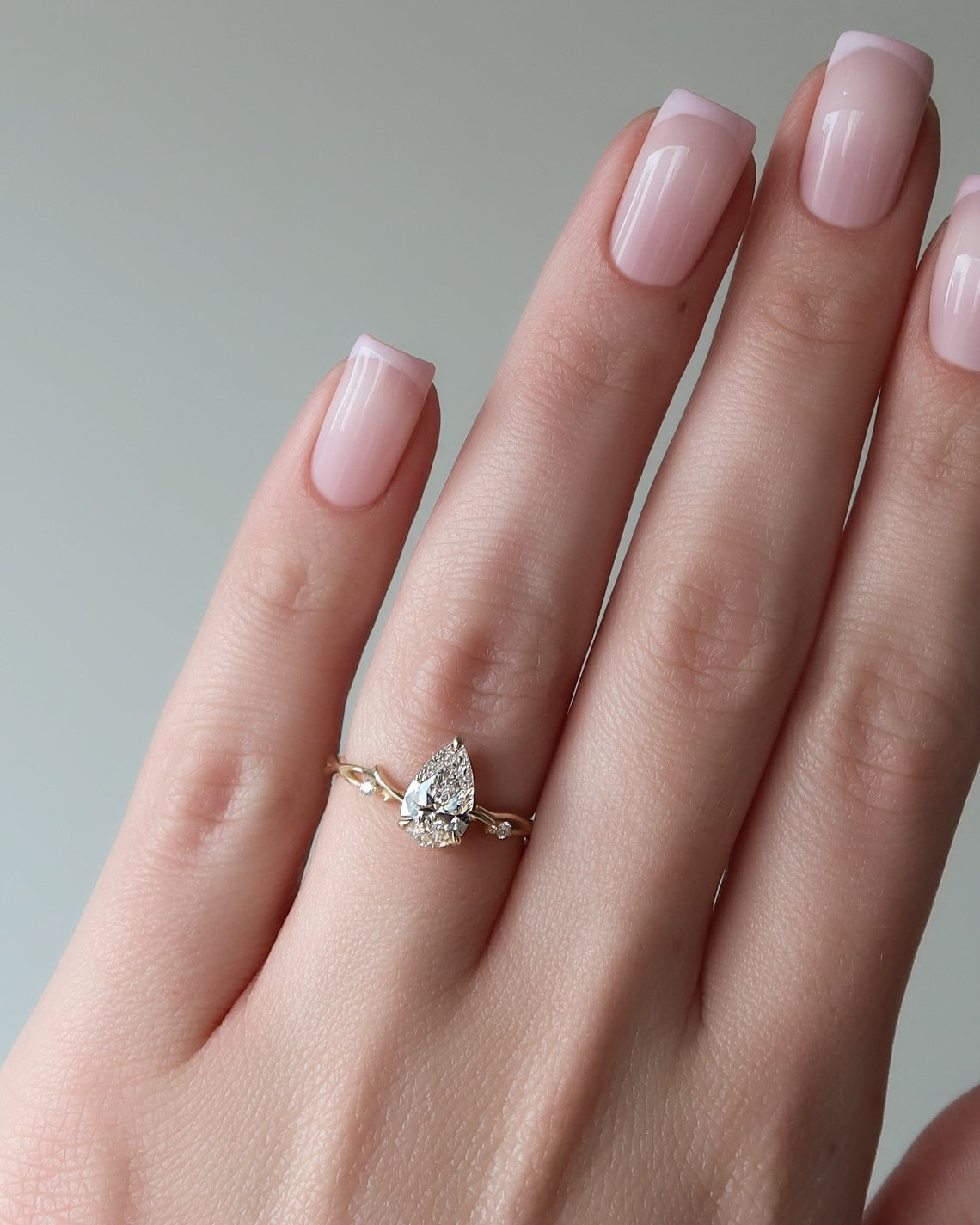 Pear cut CVD diamond engagement ring in twig-style band with organic detailing
