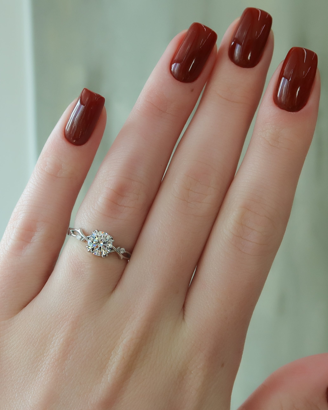 Round cut CVD diamond engagement ring with twig-inspired band in white gold