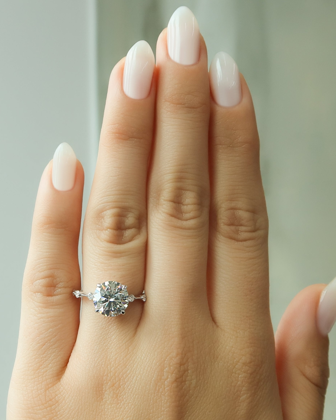 Round cut CVD diamond dainty engagement ring with slim band in white gold