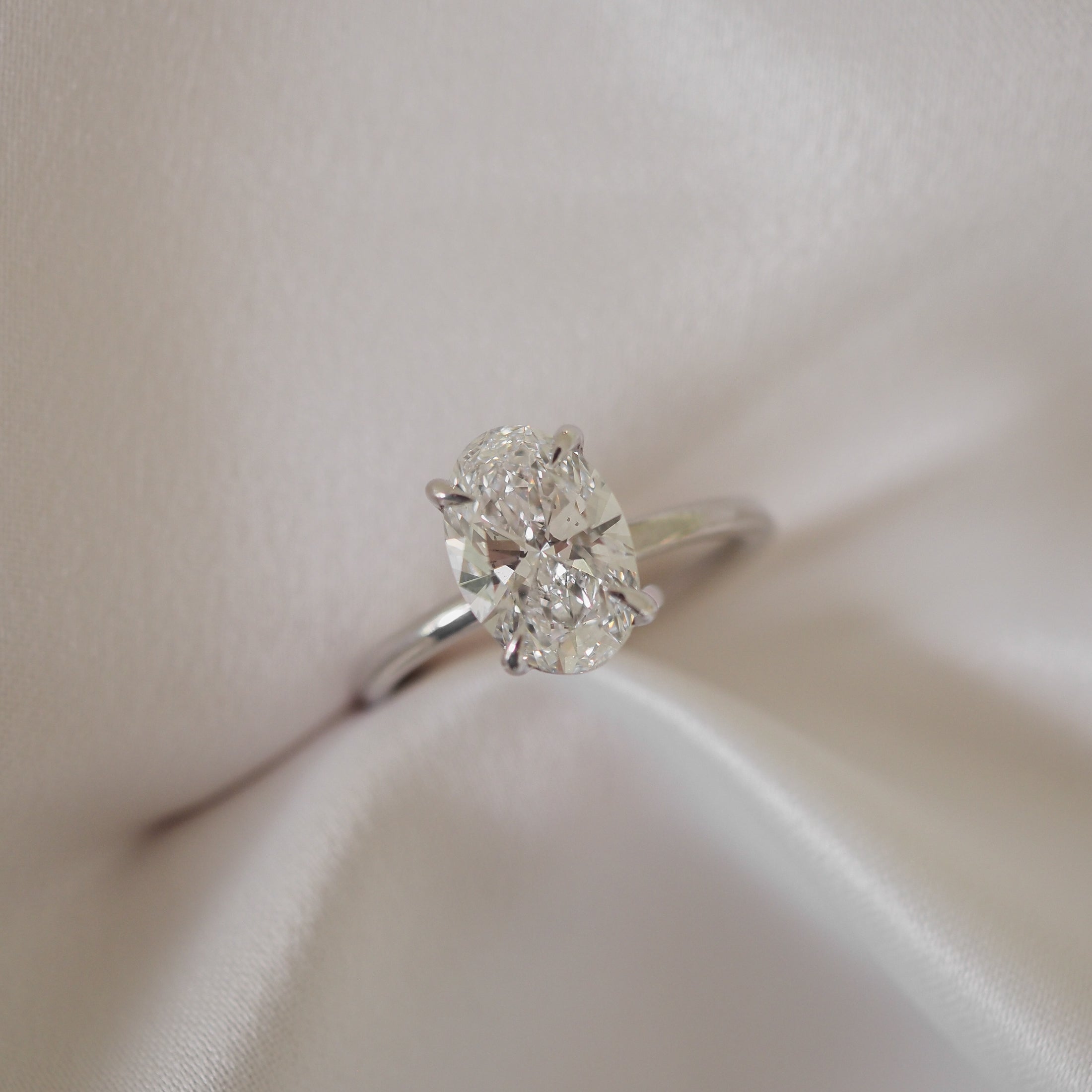 Oval cut moissanite solitaire engagement ring setting in platinum, 1.5-2.5 CT