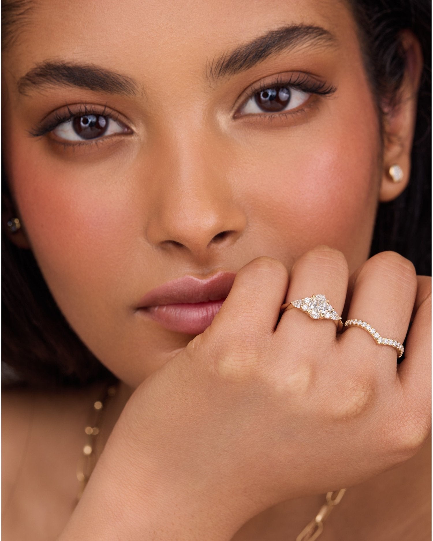1.50–3.50 CT oval cut lab grown diamond cluster engagement ring in gold, surrounded by shimmering accent stones in a floral halo design