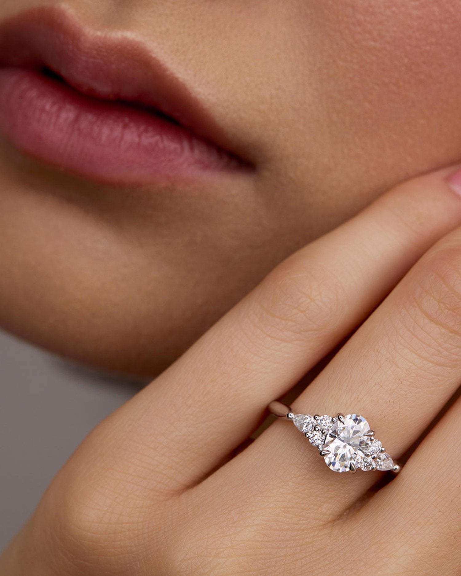 1.50–3.50 CT oval cut lab grown diamond cluster engagement ring in gold, surrounded by shimmering accent stones in a floral halo design